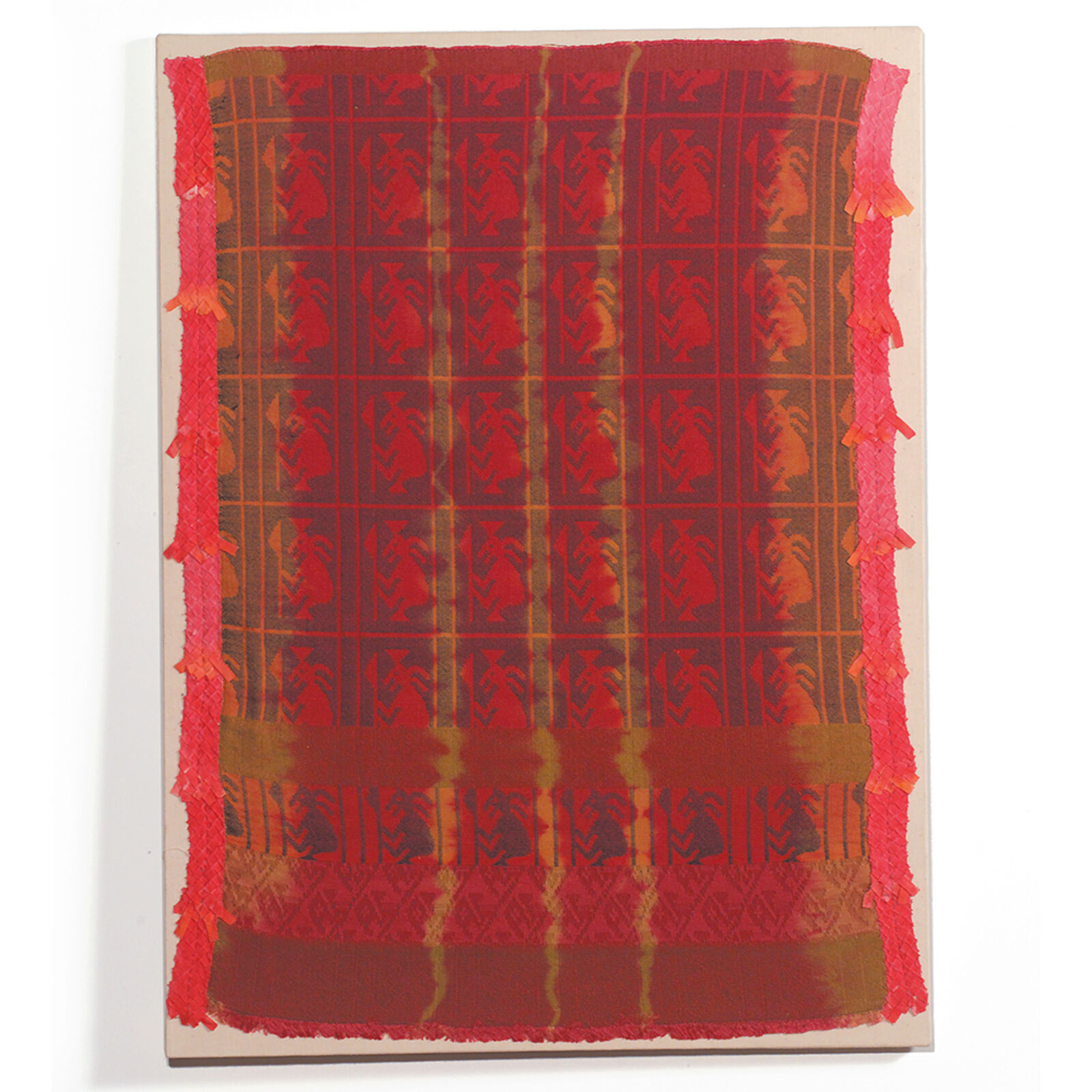 A red and brown rug with a pattern on it.