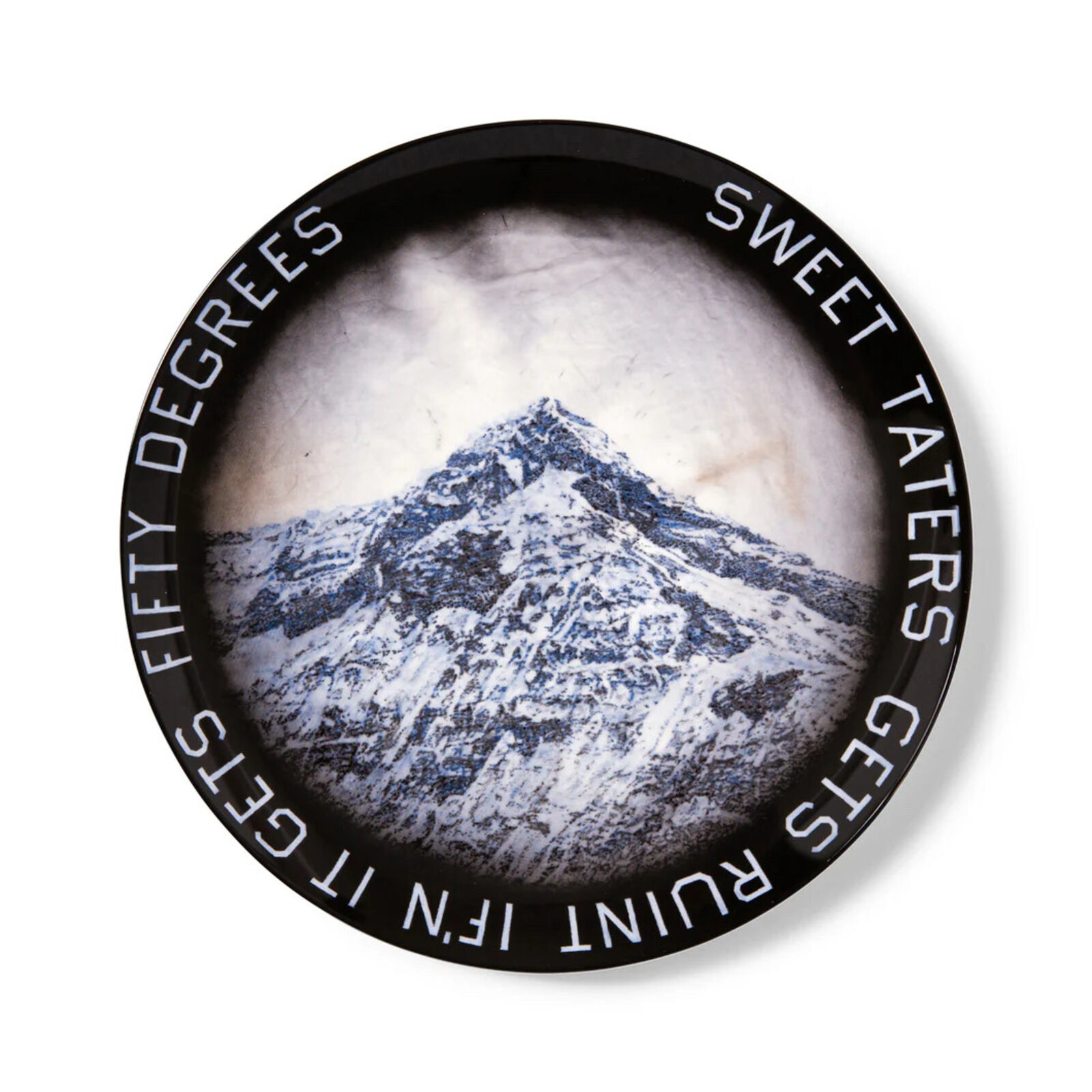 A black and white photo of a mountain with the words Sweet Taters gets it.