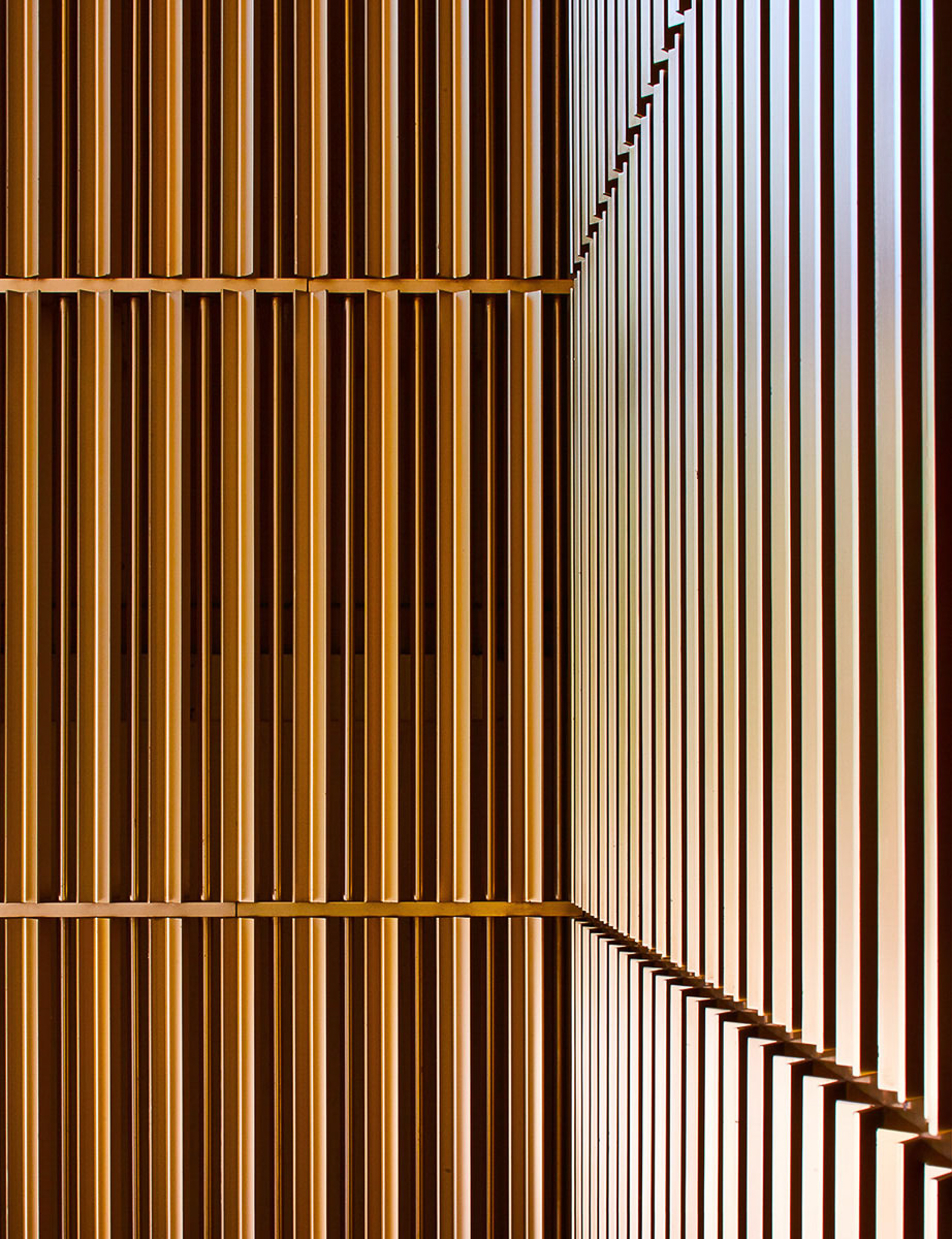 a close up of a building with a lot of wooden slats on it