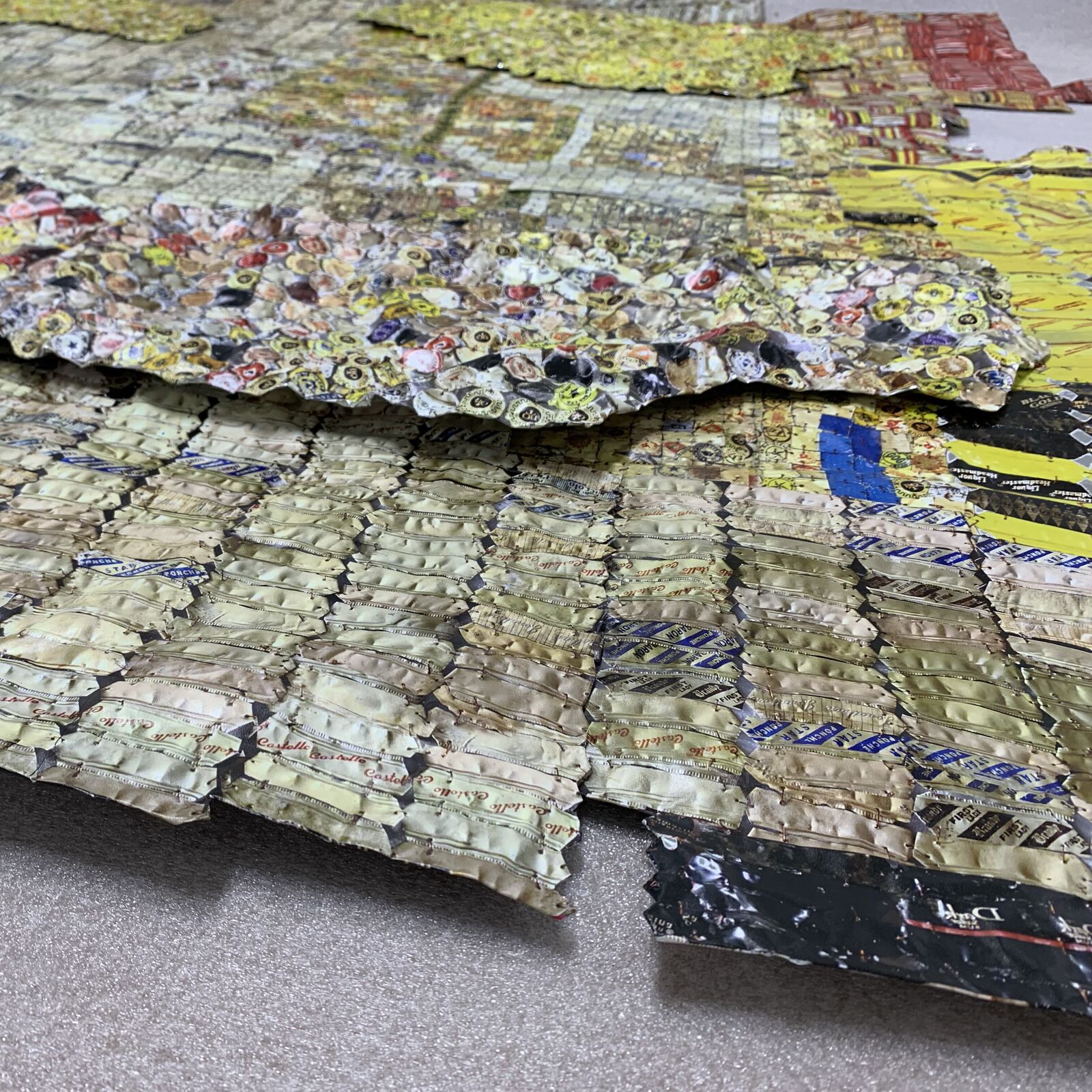 Artwork by El Anatsui, Checked Key, Made of Hand sculpted and formed UV cured acrylic resin inkjet on aluminum with irregular hand-cut edges and copper wire 