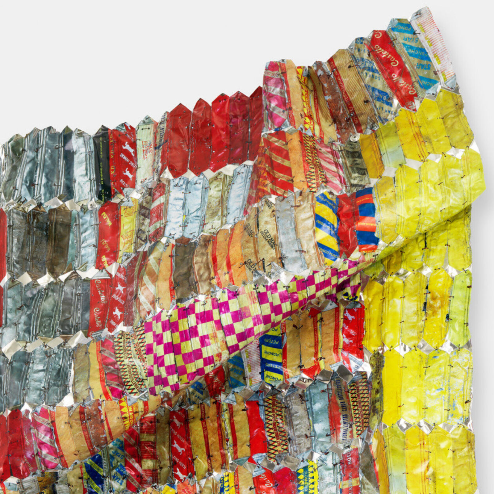 Artwork by El Anatsui, Metal Cloth, Made of Hand-sculpted and formed UV cured acrylic resin inkjet on aluminiumwith irregular hand-cut edges and copper wire 