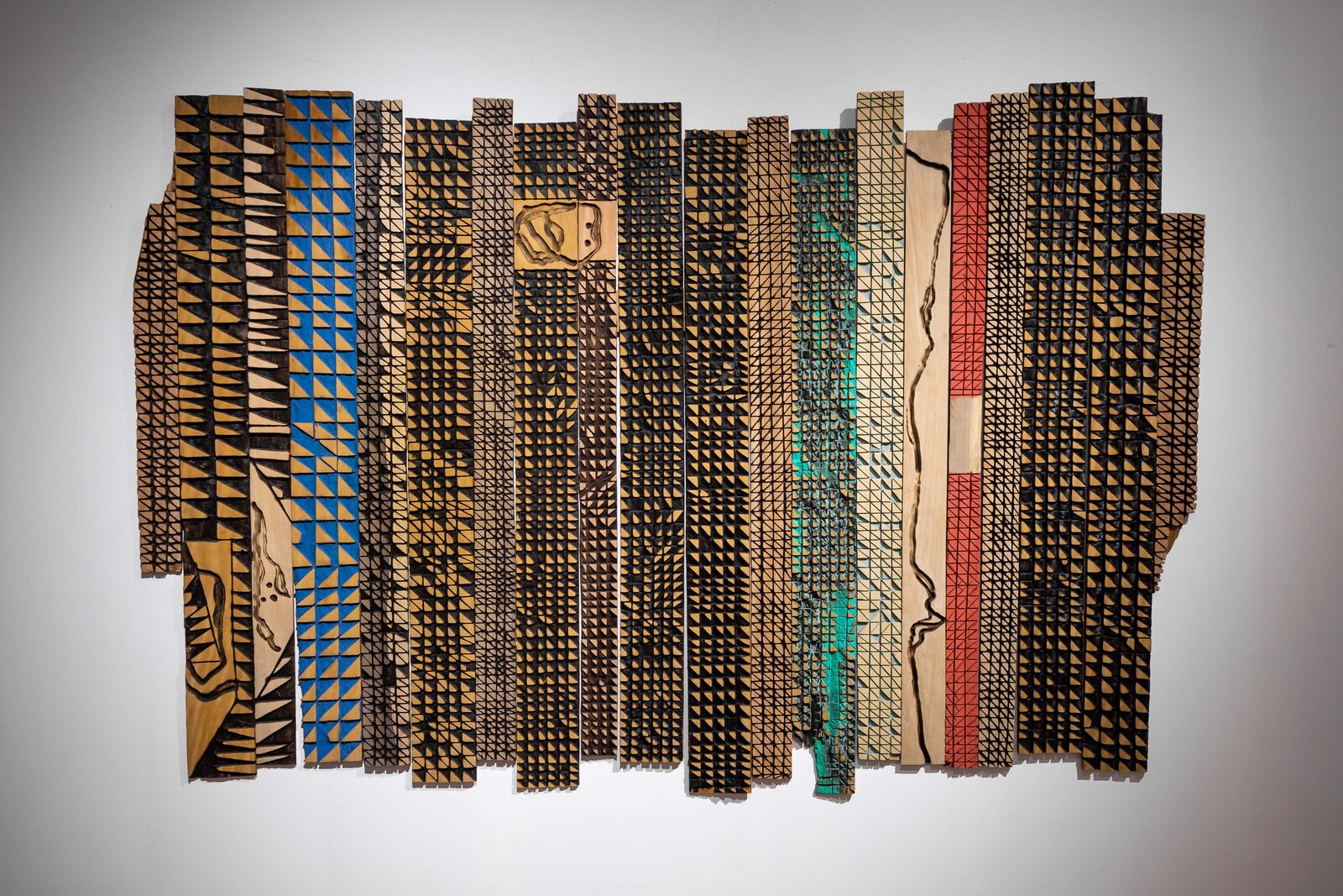 Artwork by El Anatsui, DNA, Made of Scorched tropical Hardwood 