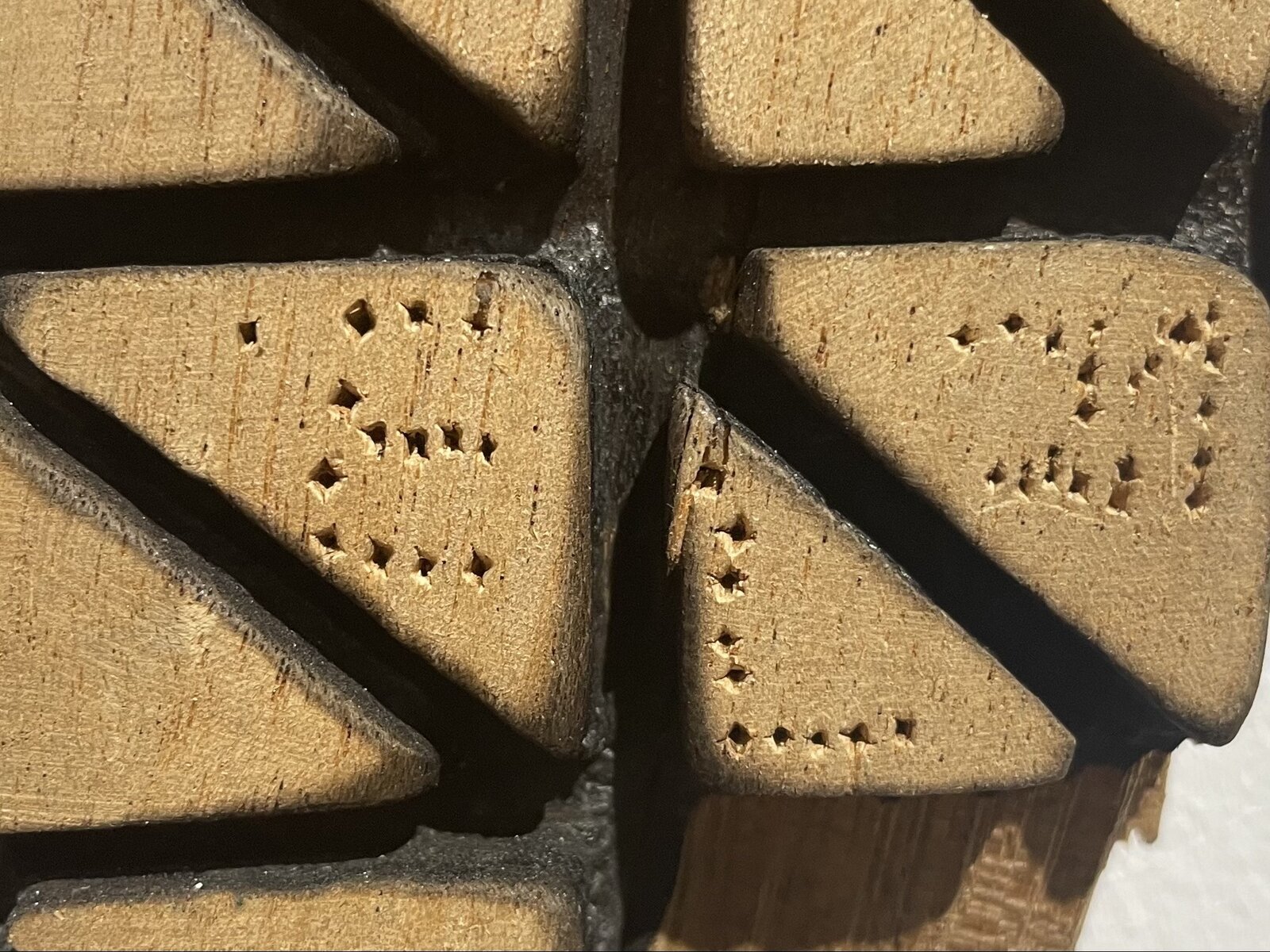 Artwork by El Anatsui, DNA, Made of Scorched tropical Hardwood 