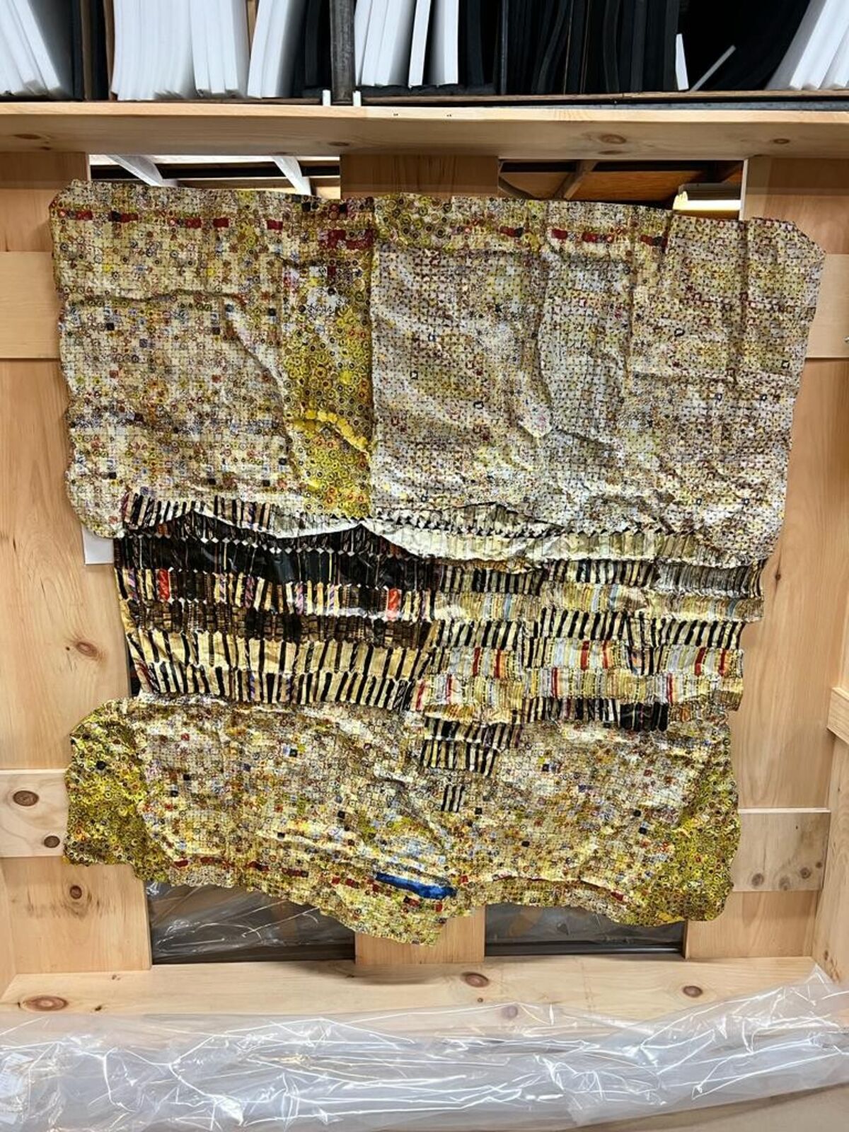 Artwork by El Anatsui, Gold Band, Made of Hand-sculpted and formed UV cured acrylic resin inkjet on aluminum with irregular hand-cut edges and copper wire 