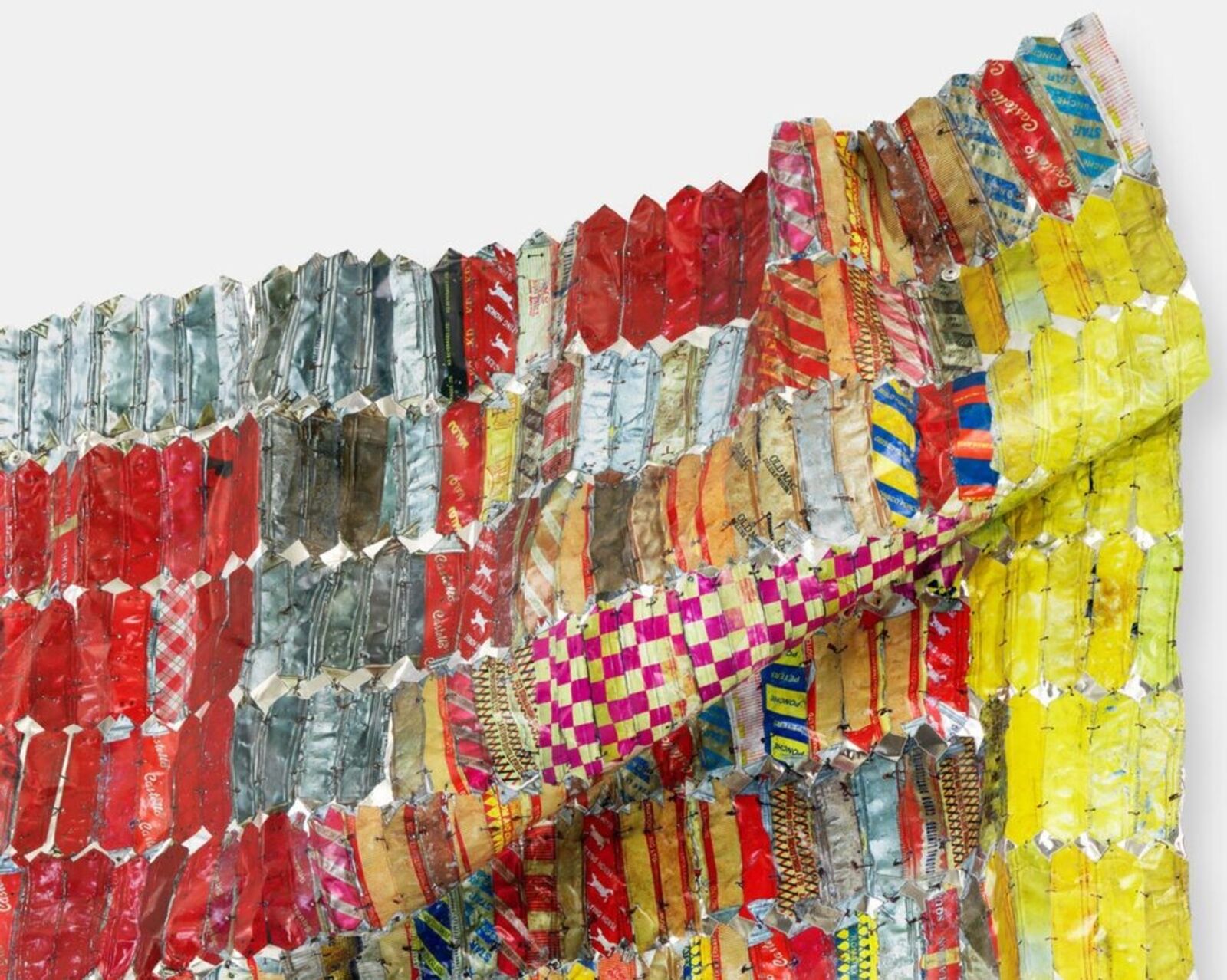 Artwork by El Anatsui, Metal Cloth, Made of Hand-sculpted and formed UV cured acrylic resin inkjet on aluminiumwith irregular hand-cut edges and copper wire 