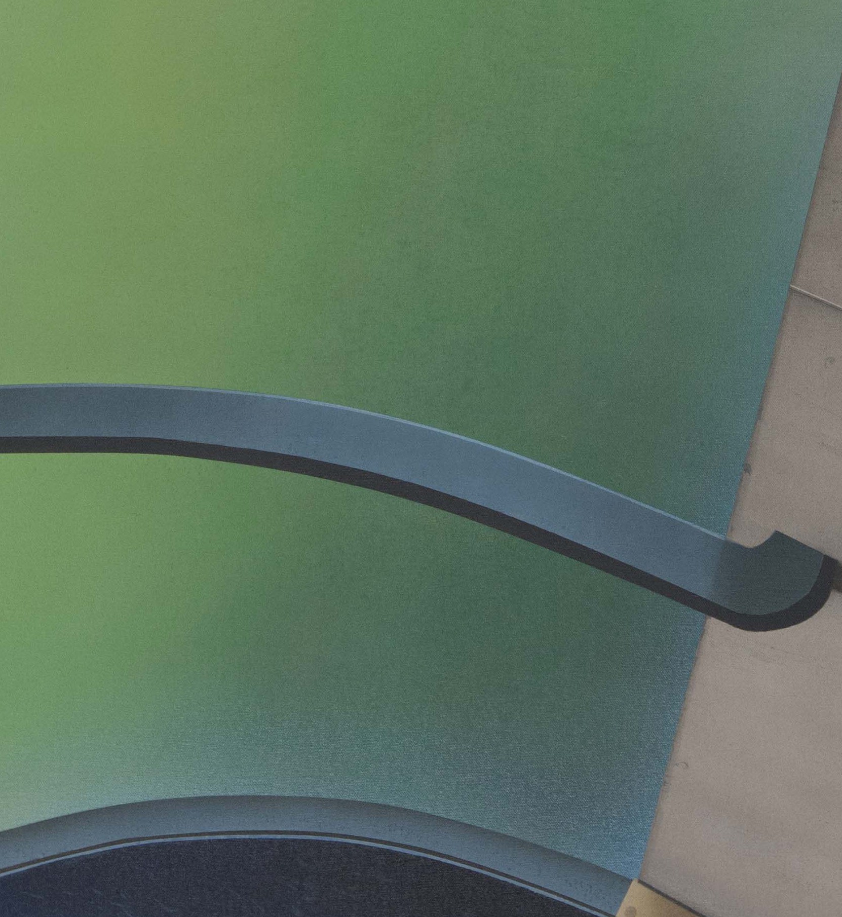 A close up of a stairwell with a green wall in the background.