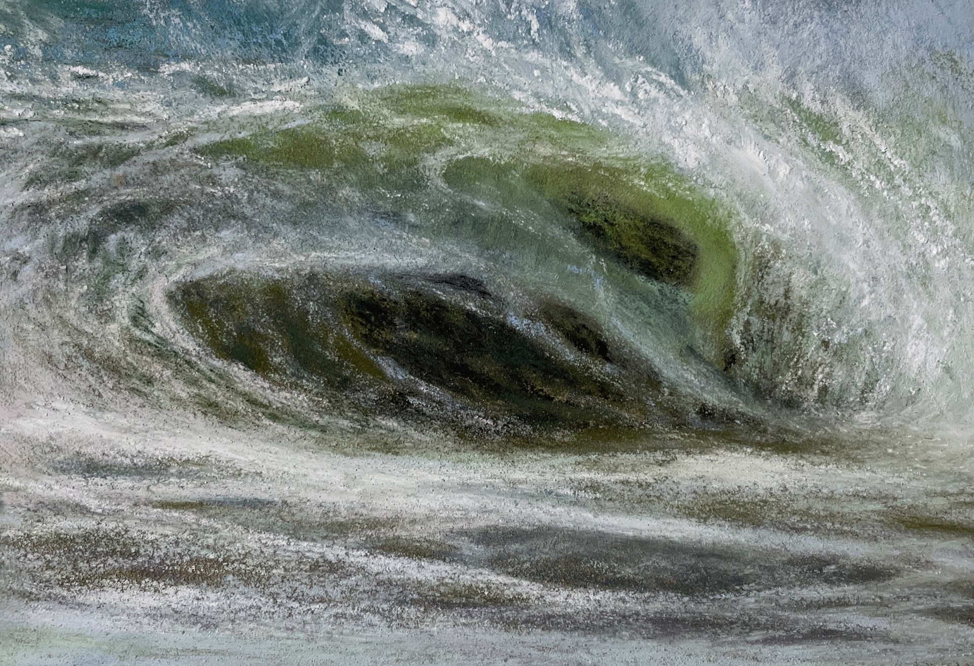 A large wave crashes against the shore of a beach.