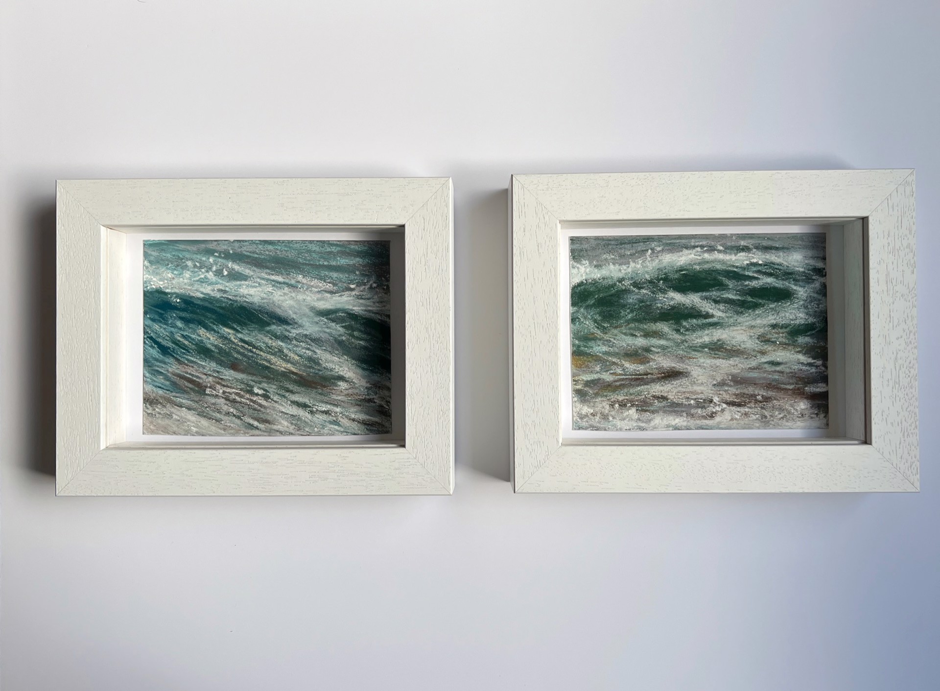A painting of a large body of water with waves crashing on the shore.
