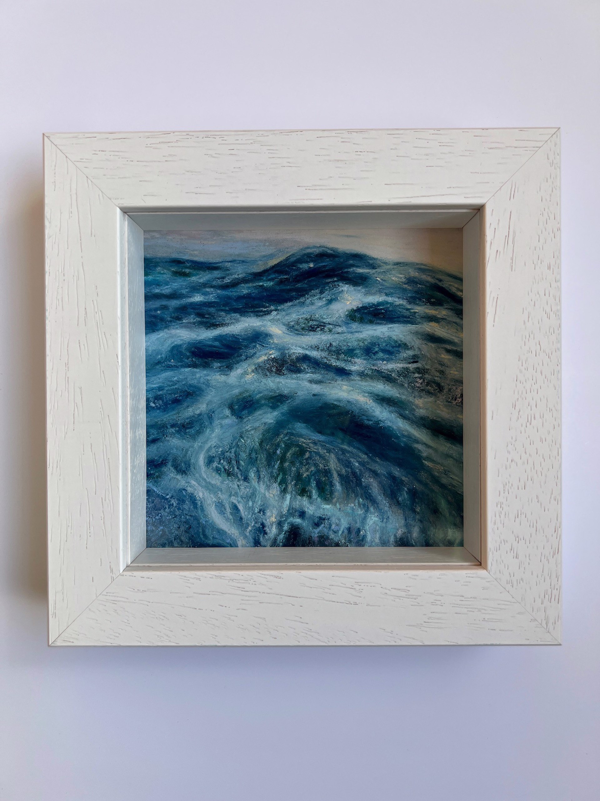 A painting of a large body of water with waves crashing on the shore.