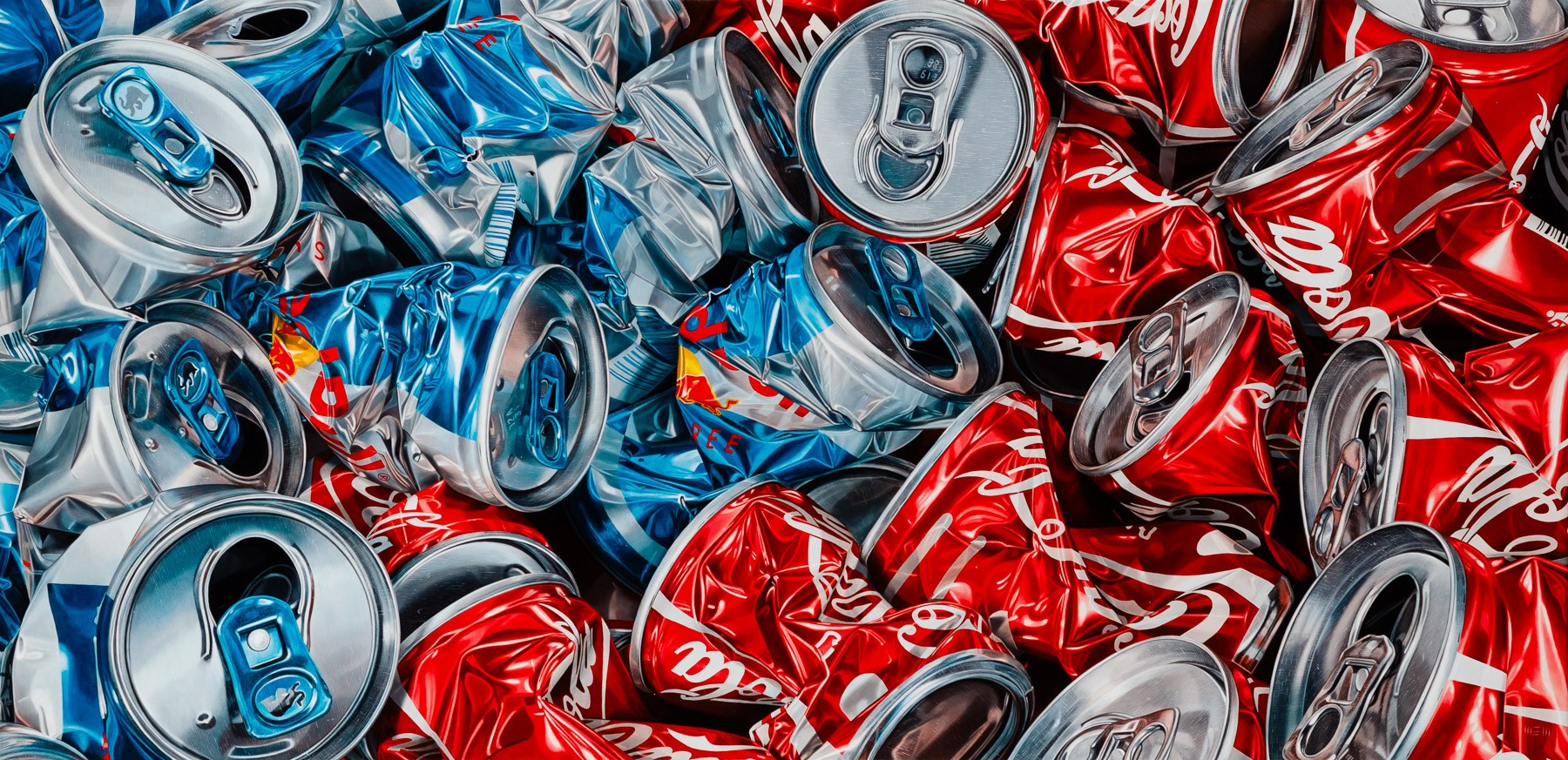 A pile of aluminum cans sitting on top of each other.