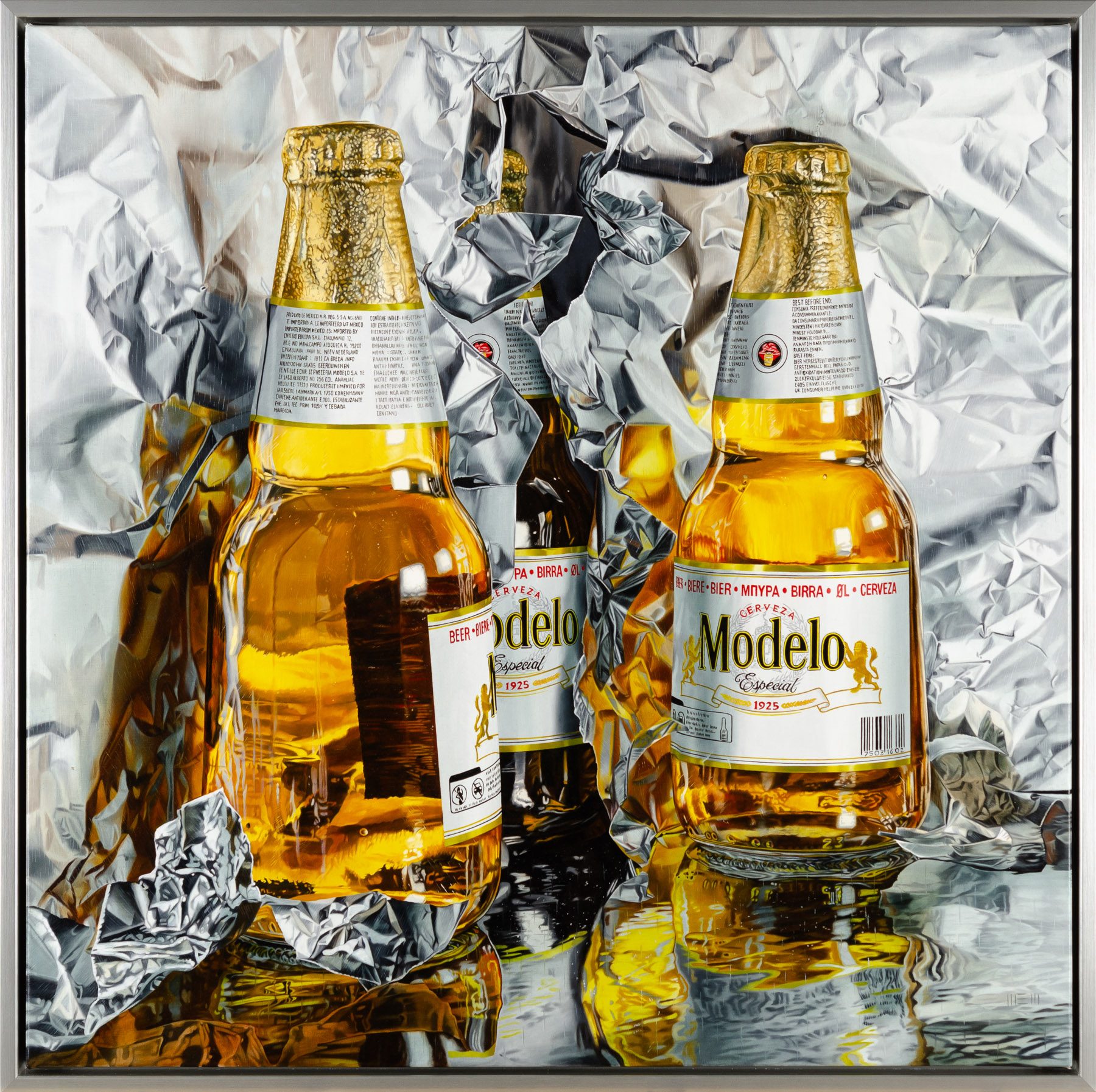 Two bottles of beer sitting on top of a table.