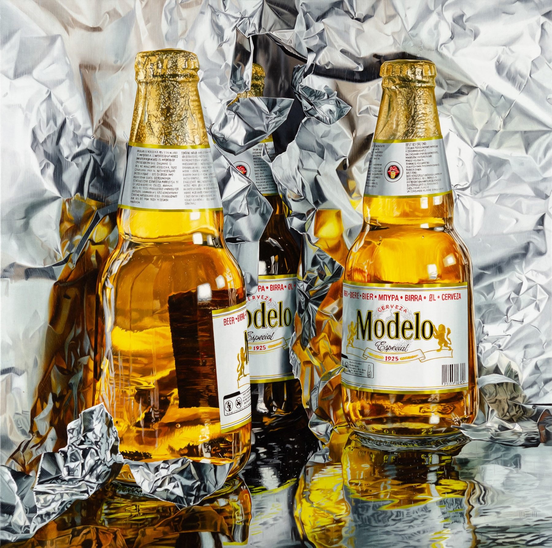 Two bottles of beer sitting on top of a table.