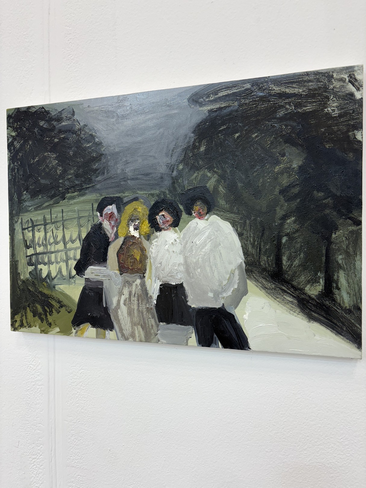 A painting of a group of people walking down a street.