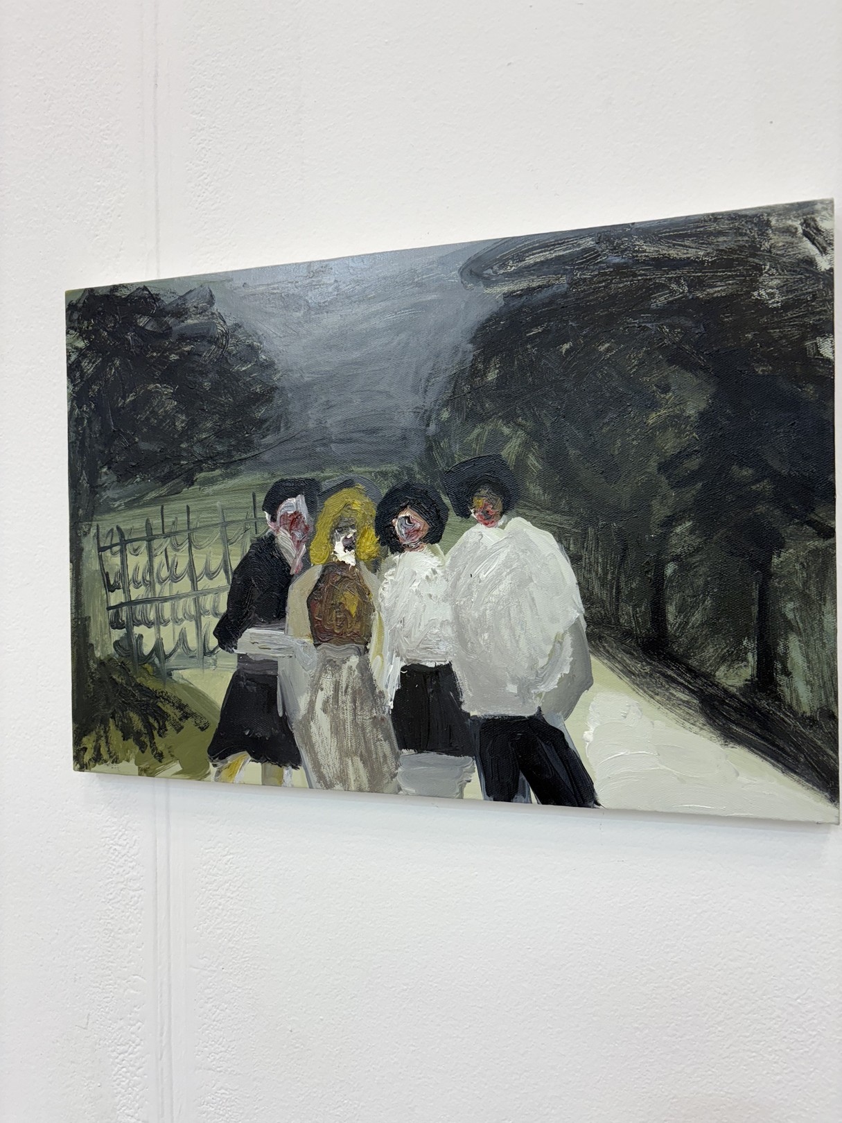 A painting of a group of people walking down a street.