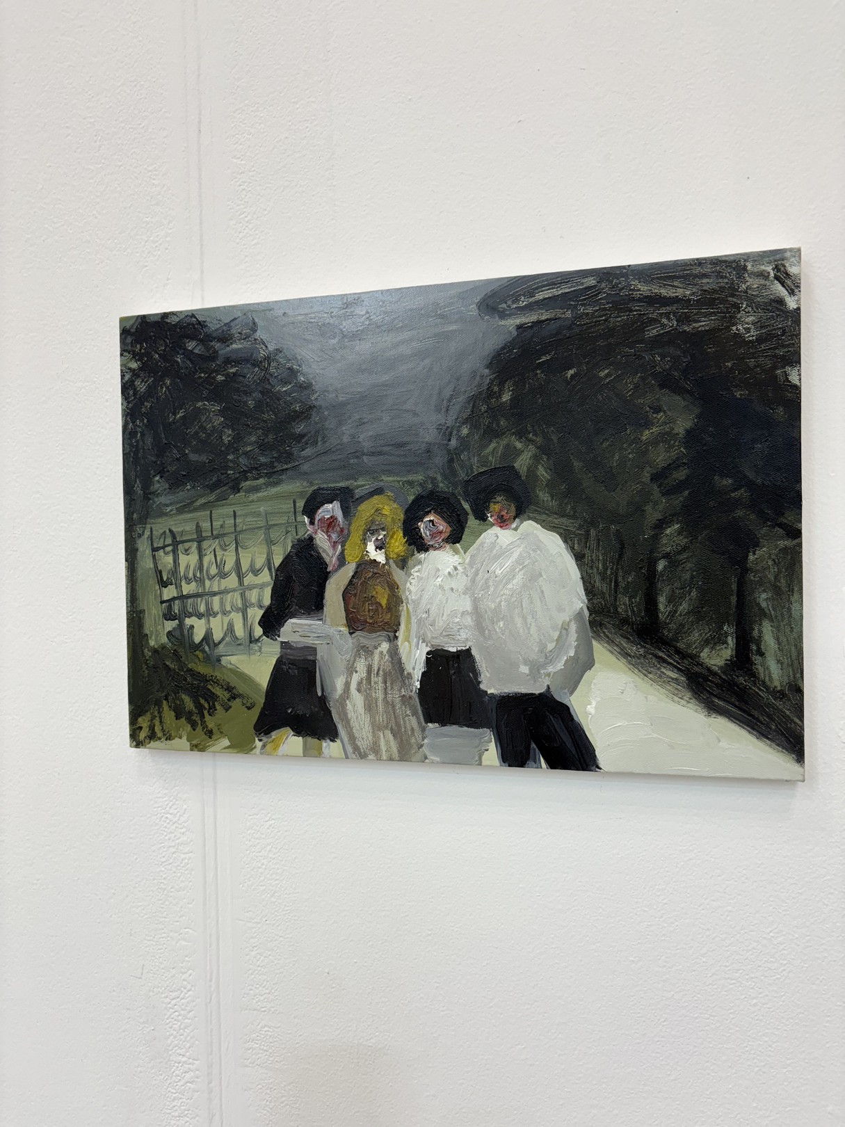 A painting of a group of people walking down a street.