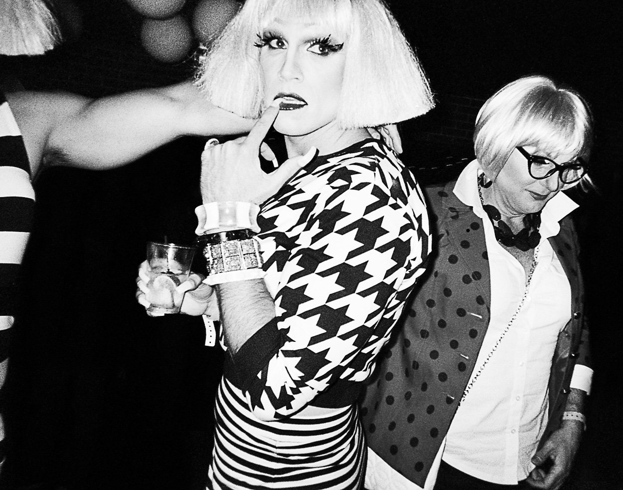 A group of people dressed up in costumes at a party.