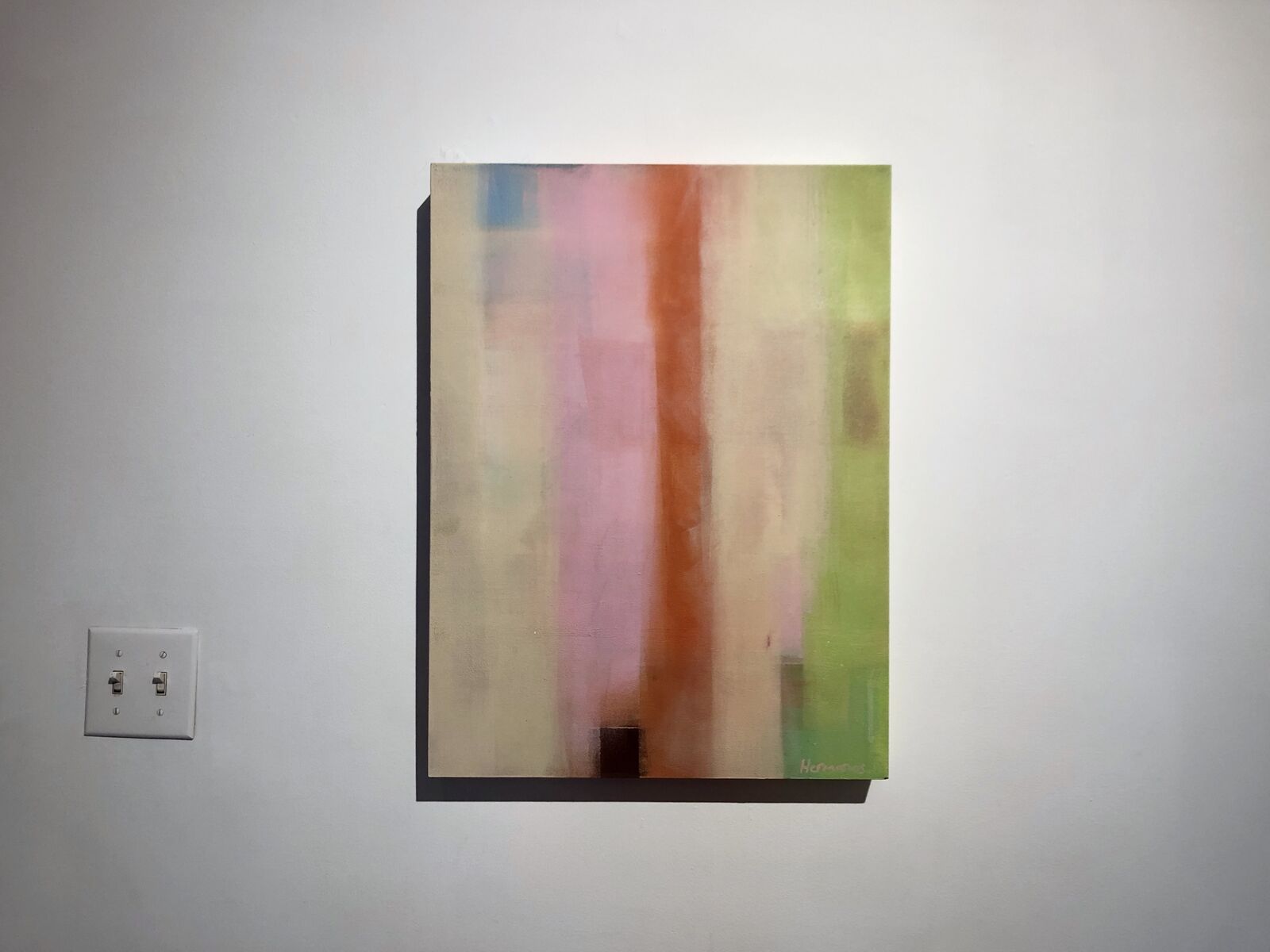 A vertical abstract composition featuring soft pastel bands of color against a textured background.