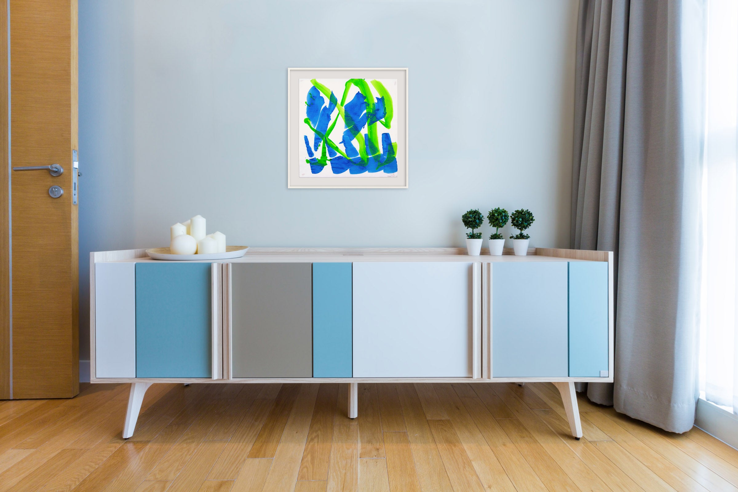 A blue and green painting on a white background.