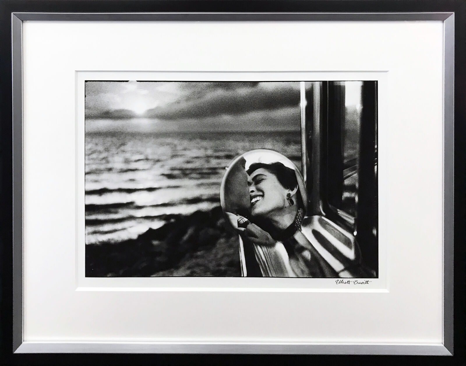 CALIFORNIA KISS, SAN MONICA, 1955 by Elliott Erwitt, circa 1955