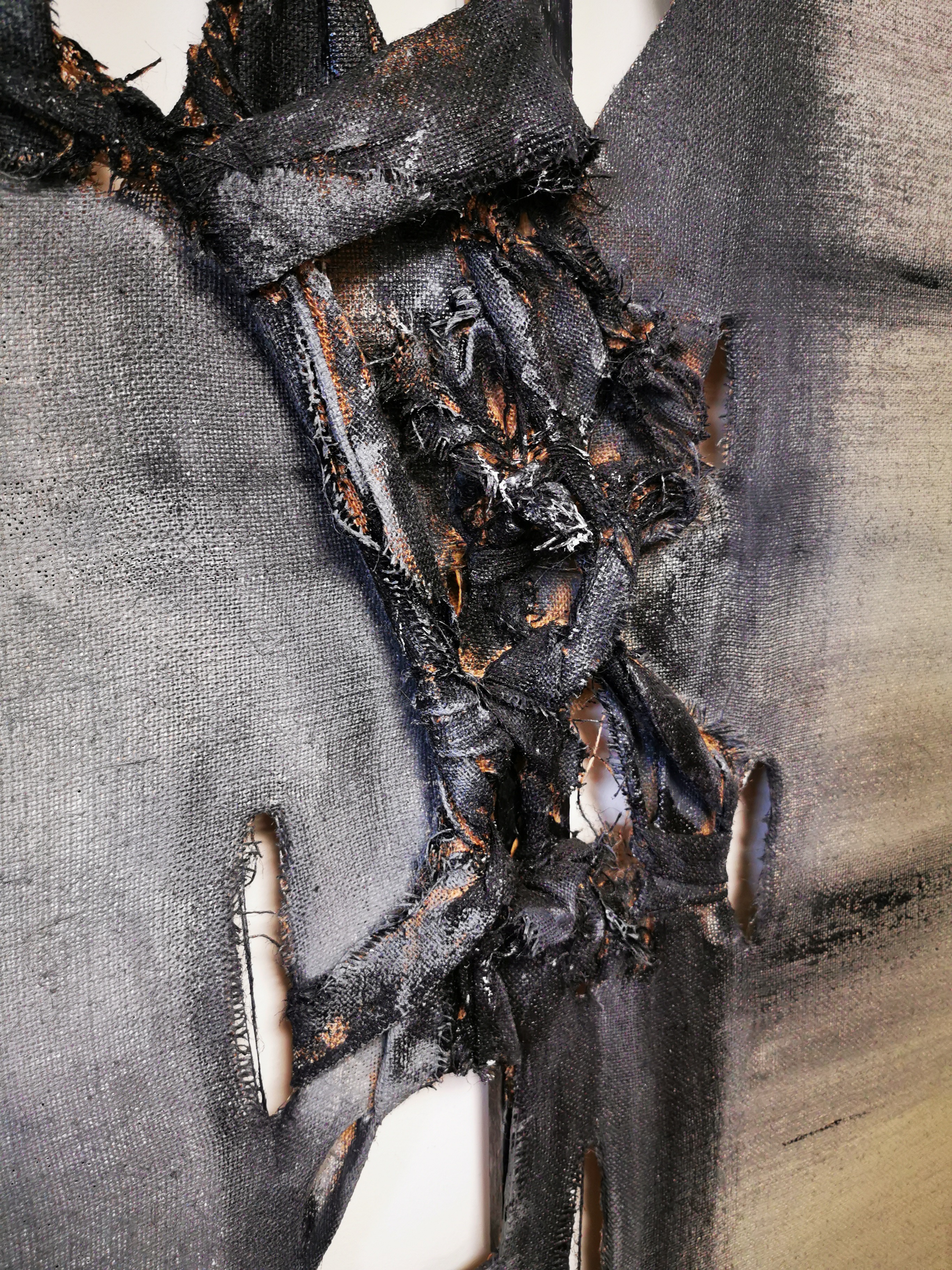A piece of black fabric with a hole in it.