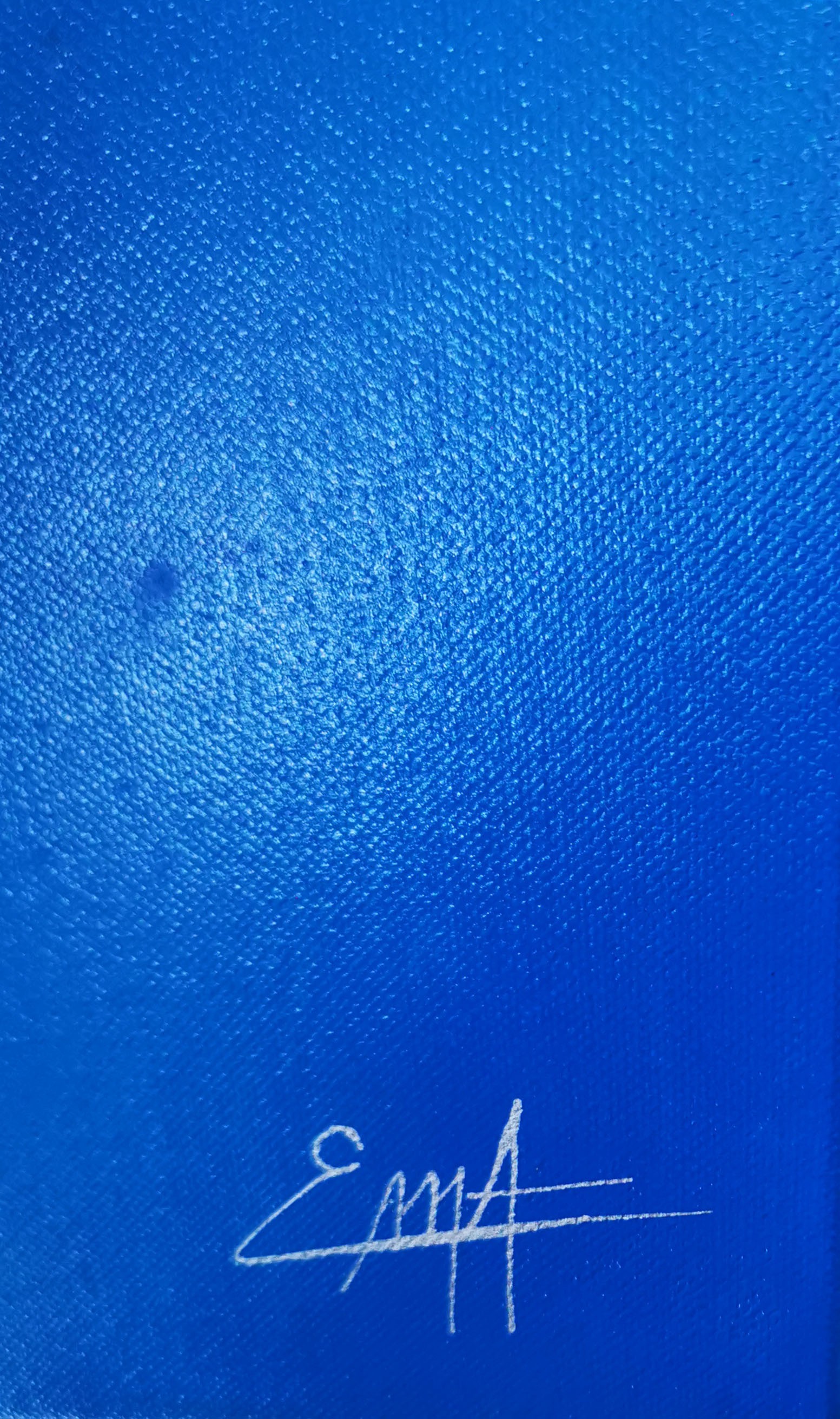 A painting of a blue sky with a black frame.