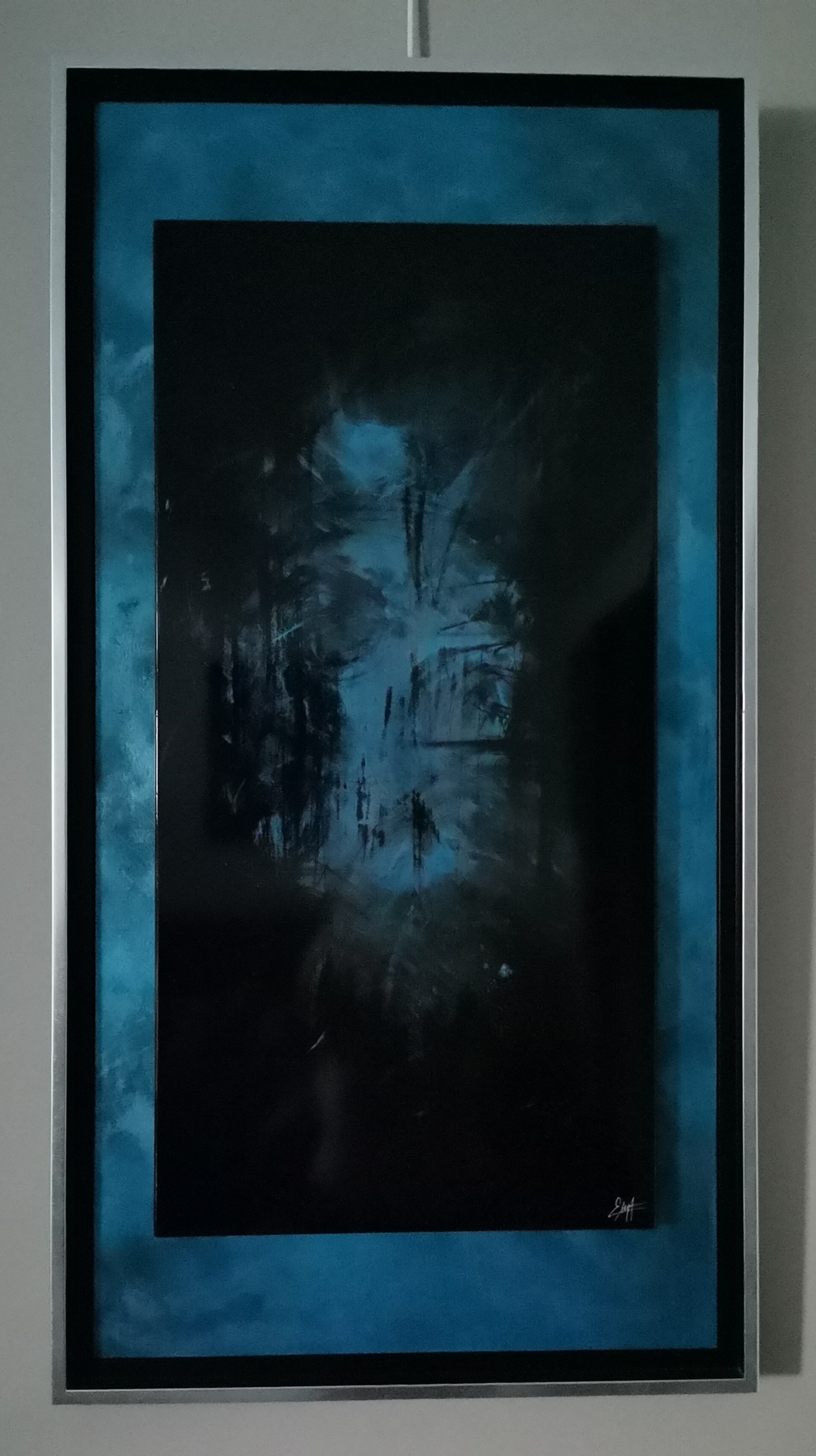 A painting hanging on a wall in a room.