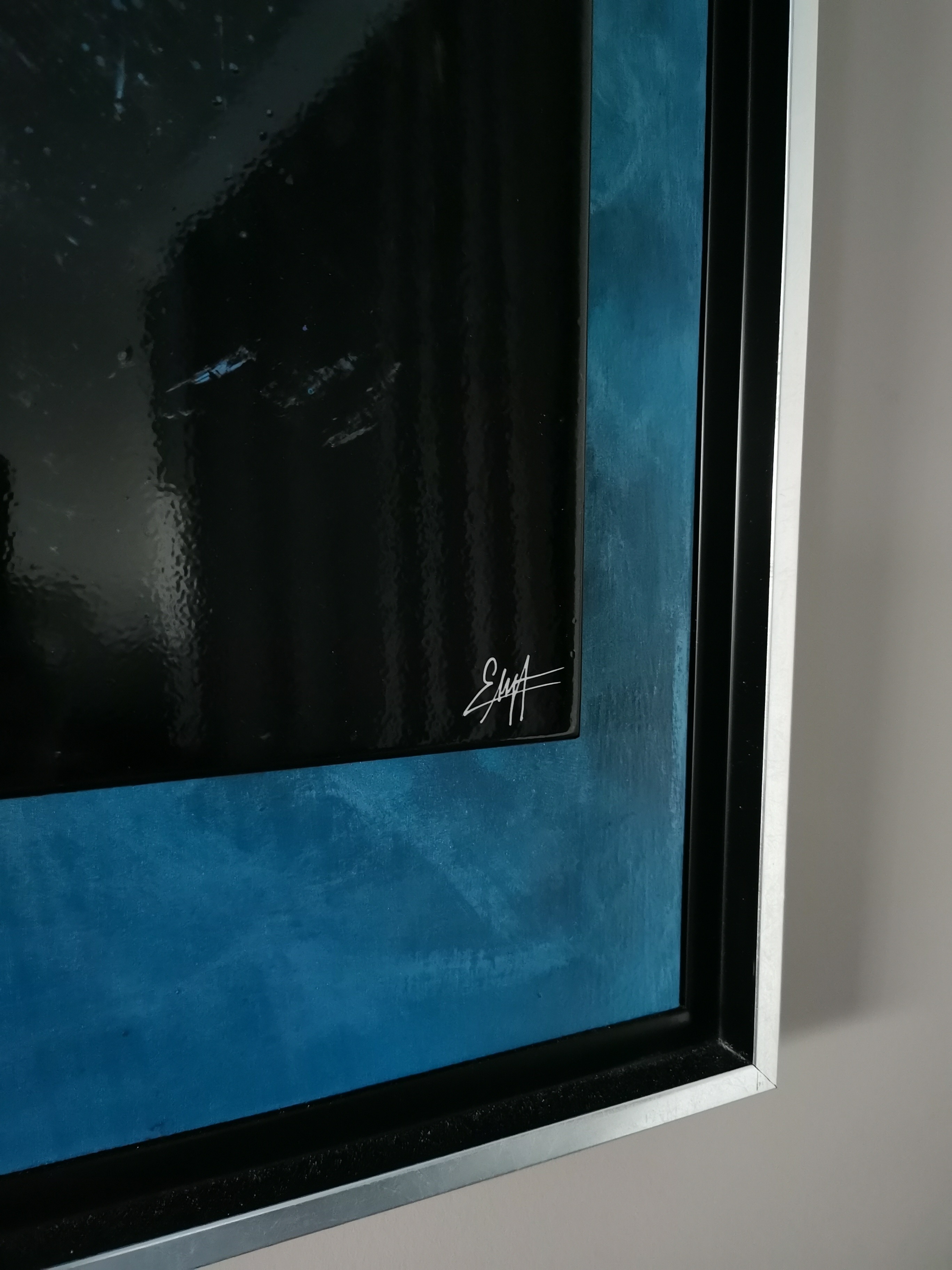 A painting hanging on a wall in a room.