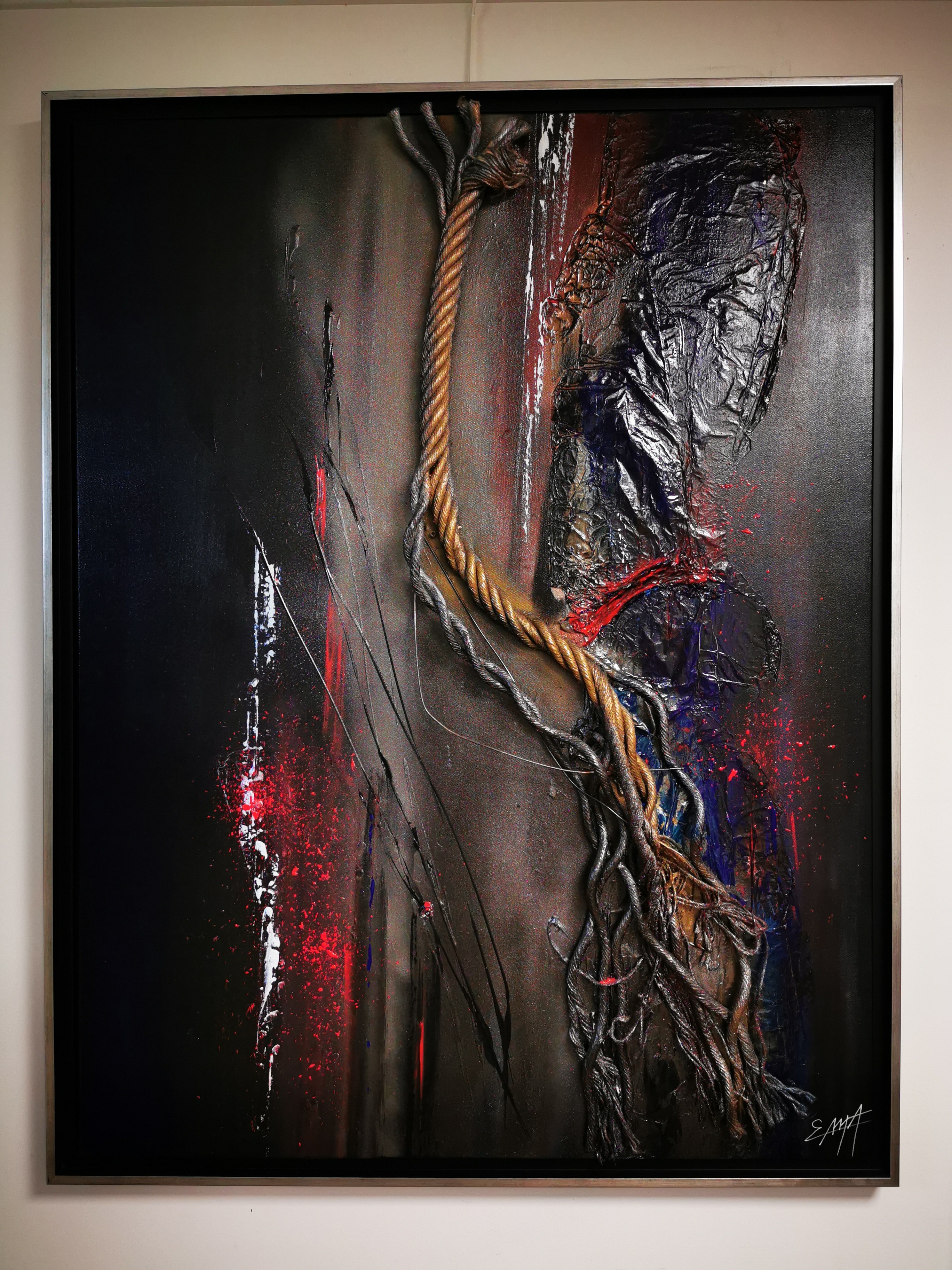 A painting hanging on a wall in a room.