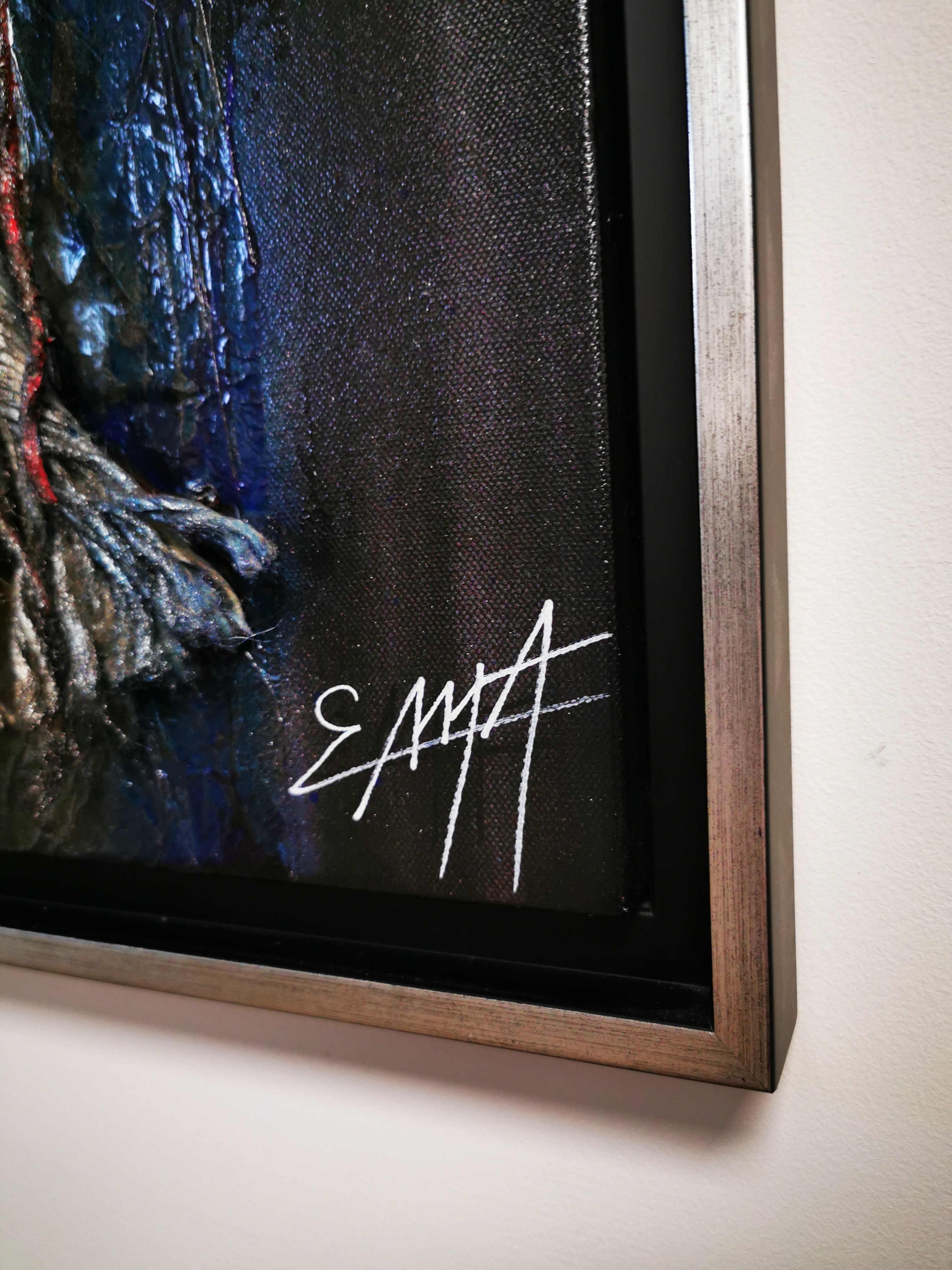 A painting hanging on a wall in a room.