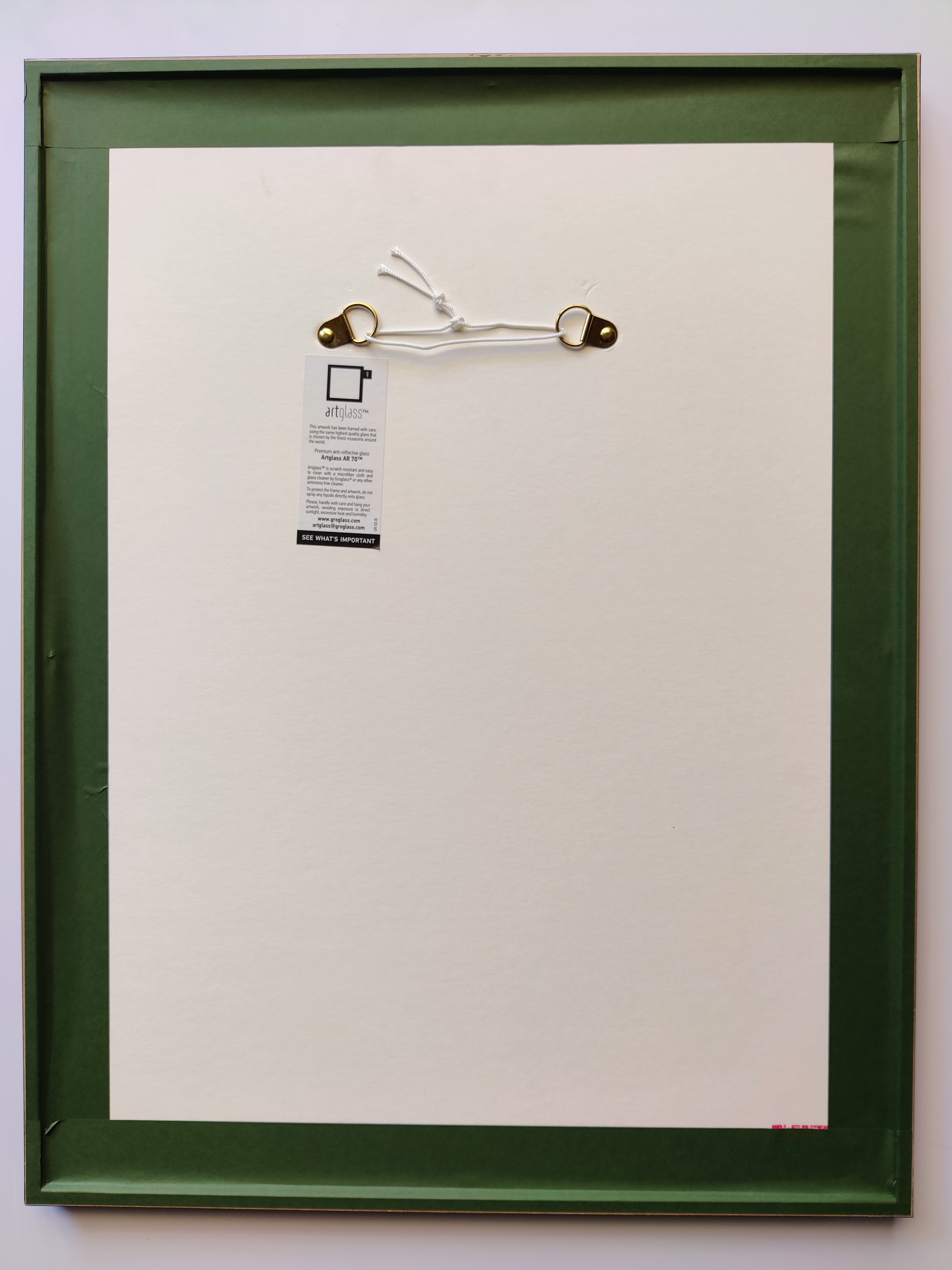 A red and white poster with a toothbrush sticking out of it.