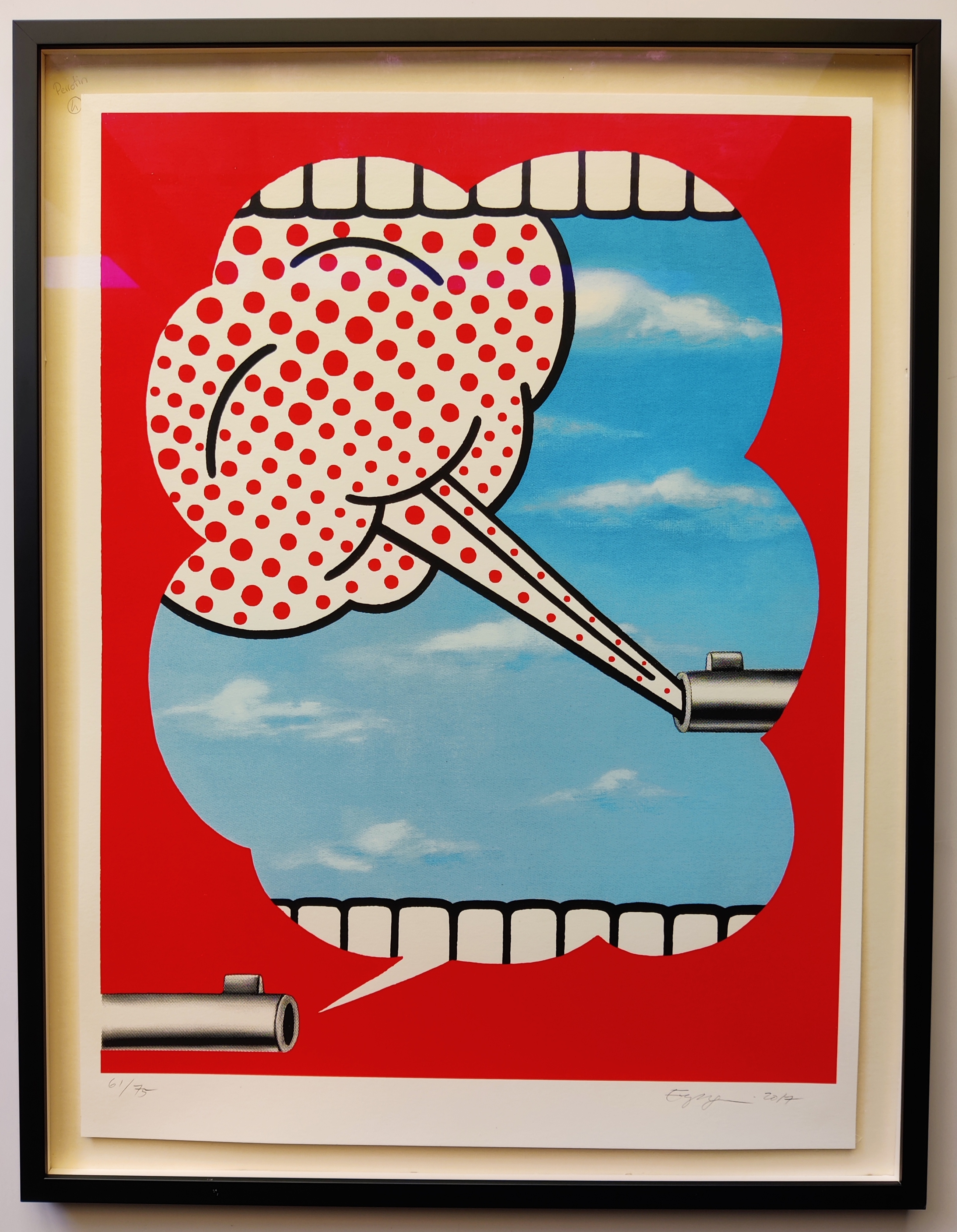 A red and white poster with a toothbrush sticking out of it.