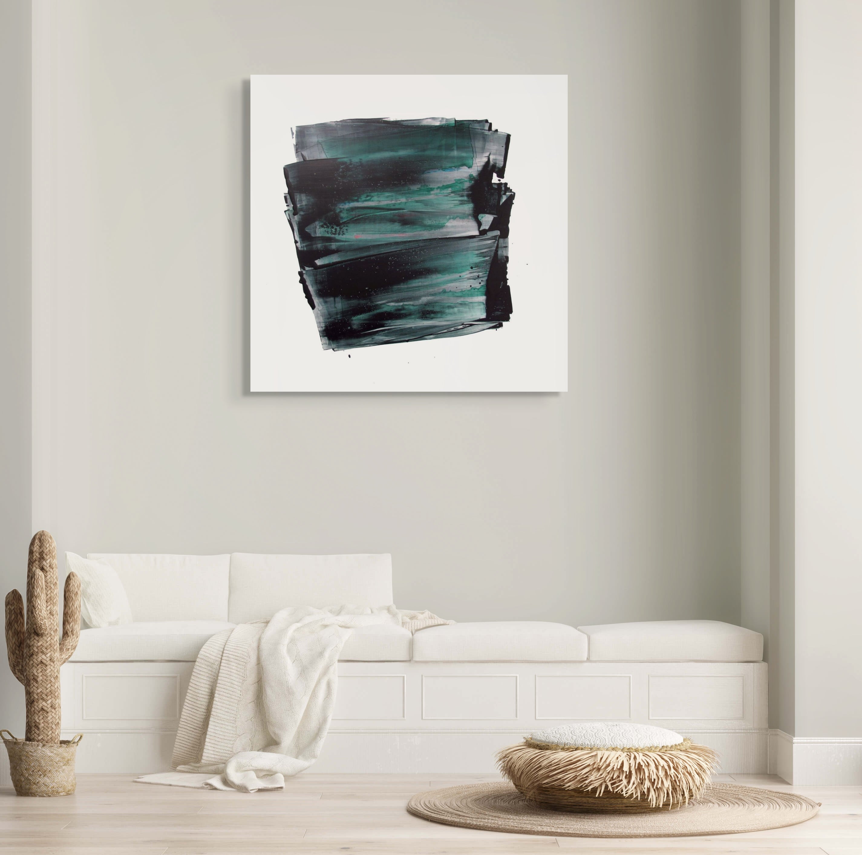 A black and green painting on a white wall.