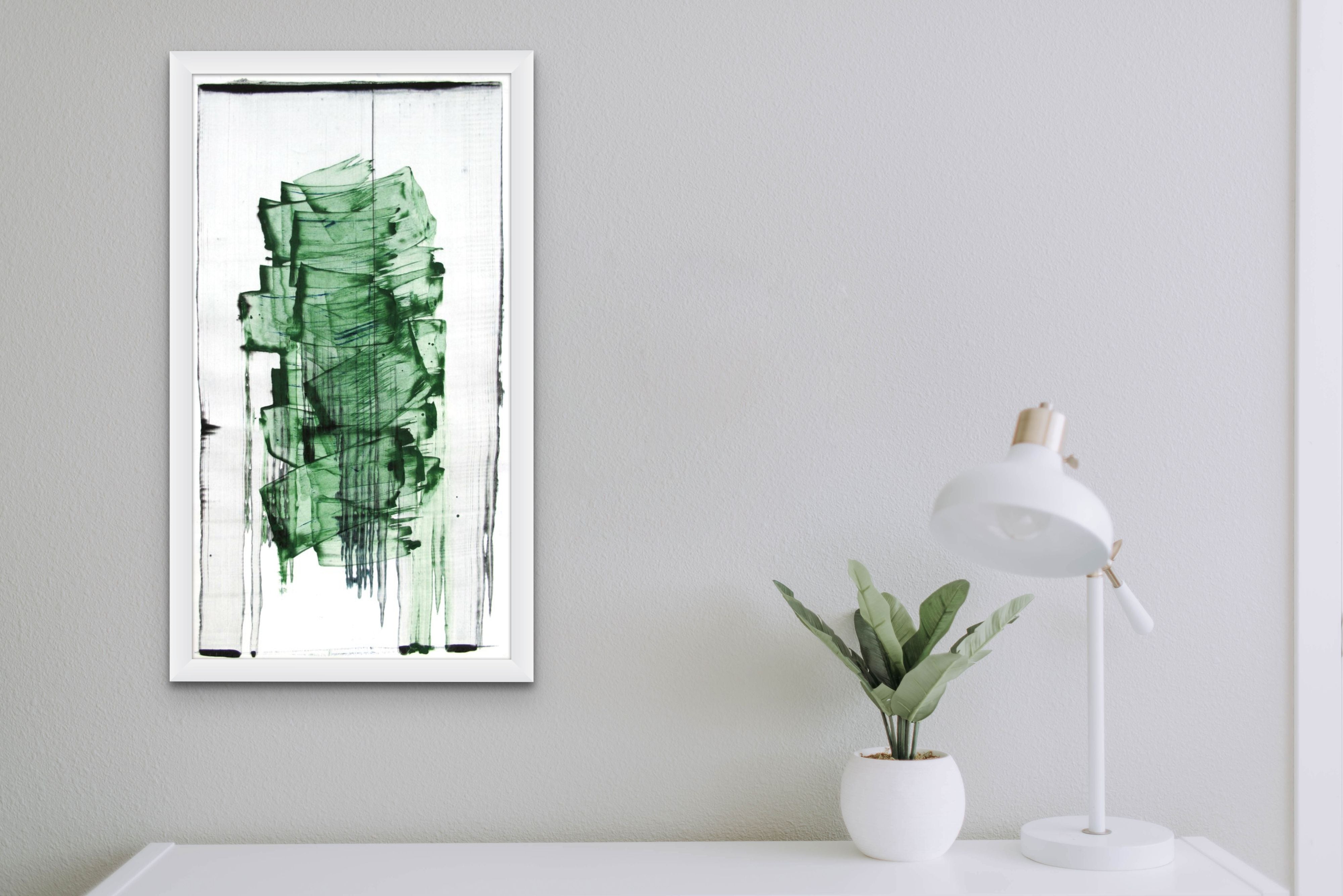 A painting with green paint on a white background. 