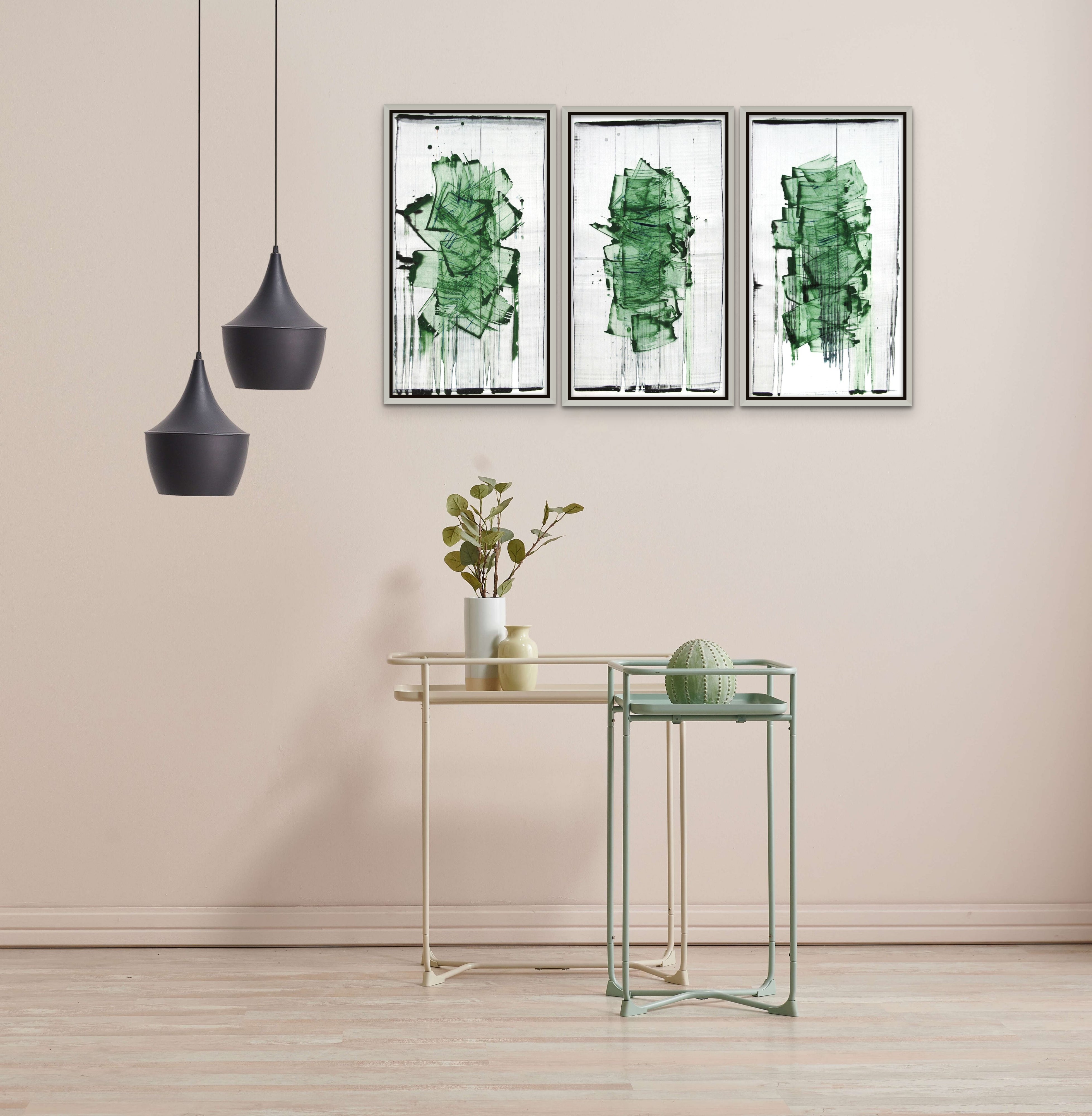 A painting with green paint on a white background. 