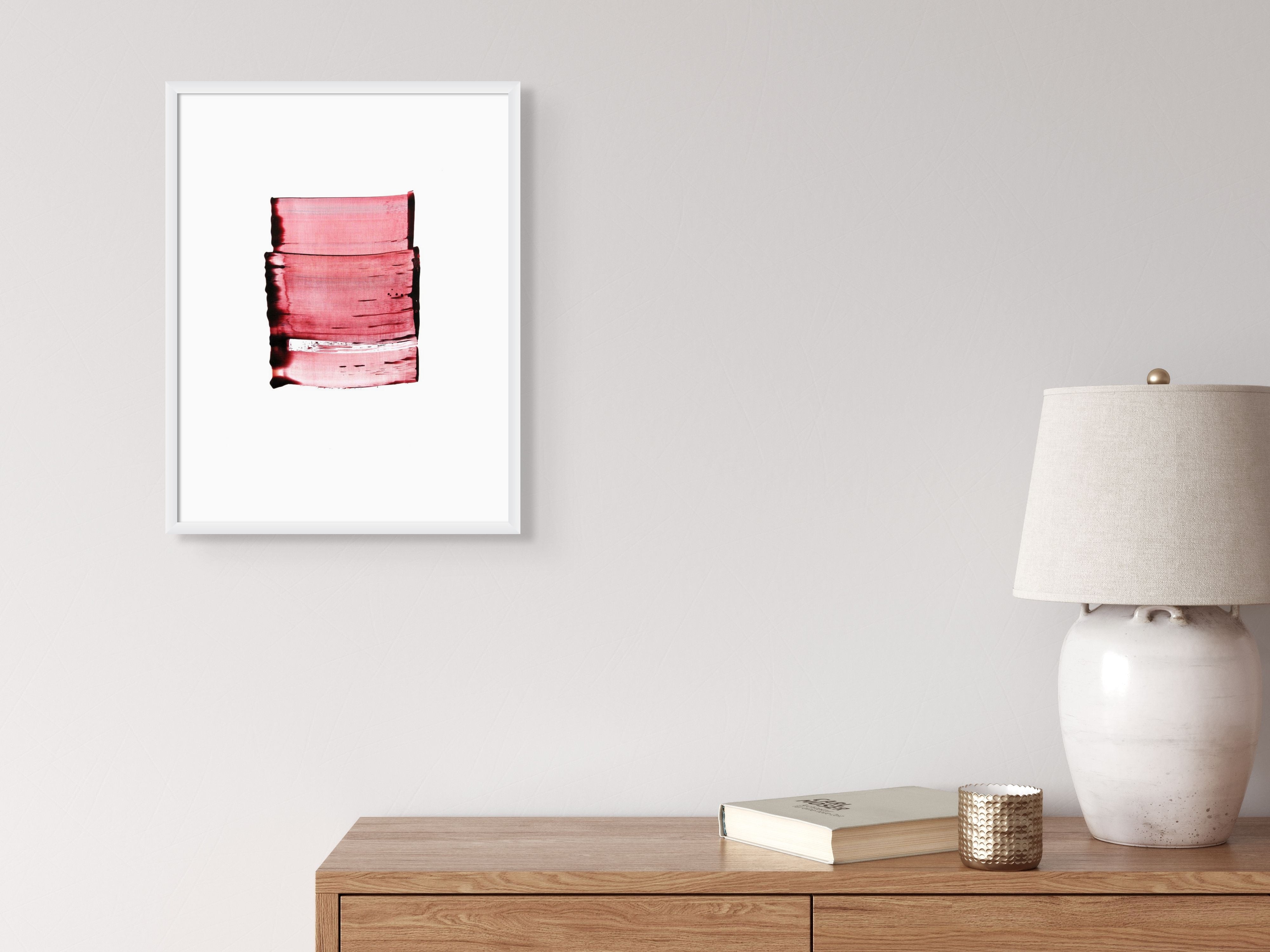 A picture of a red painting on a white background.