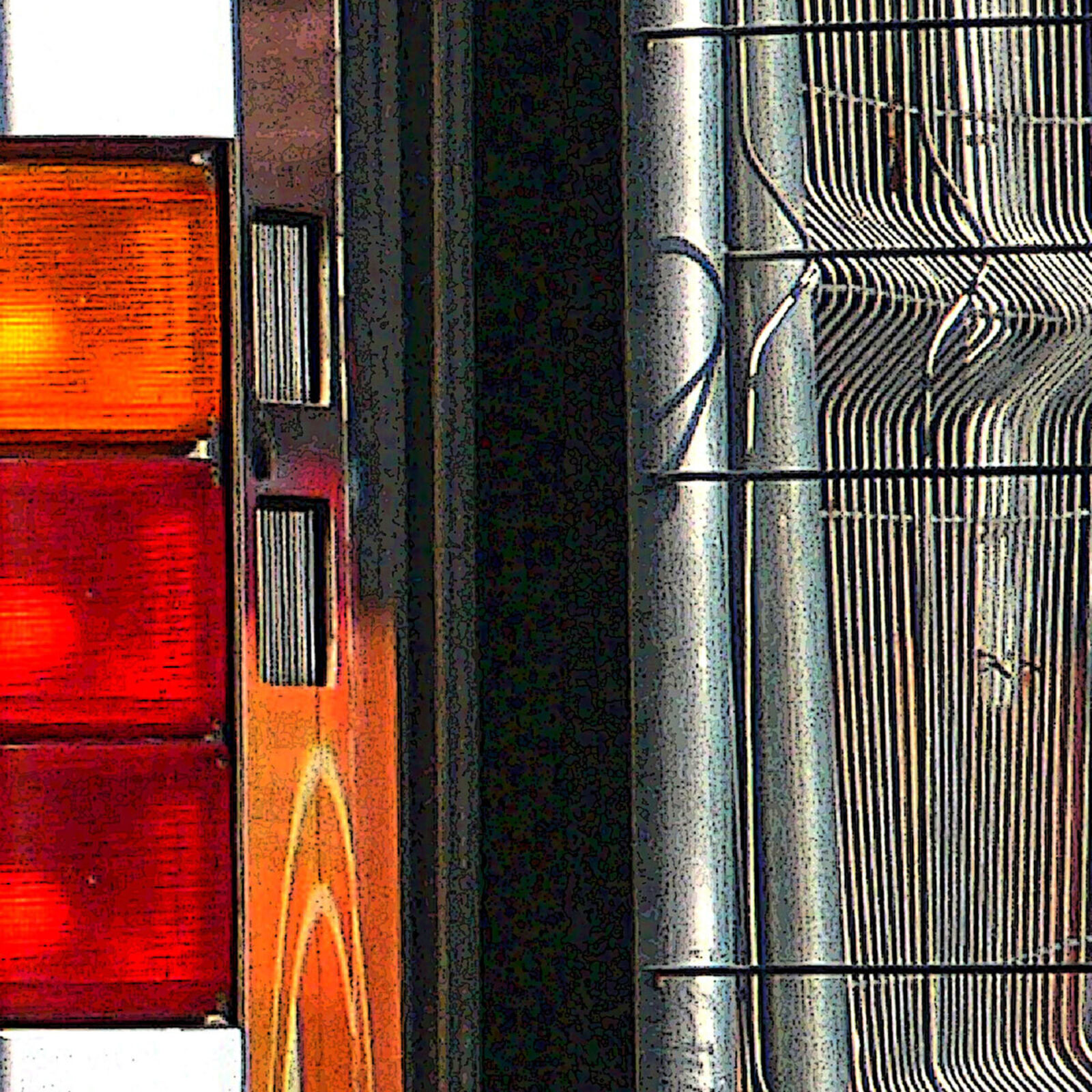 A woman walking past a bus with a poster on the back.