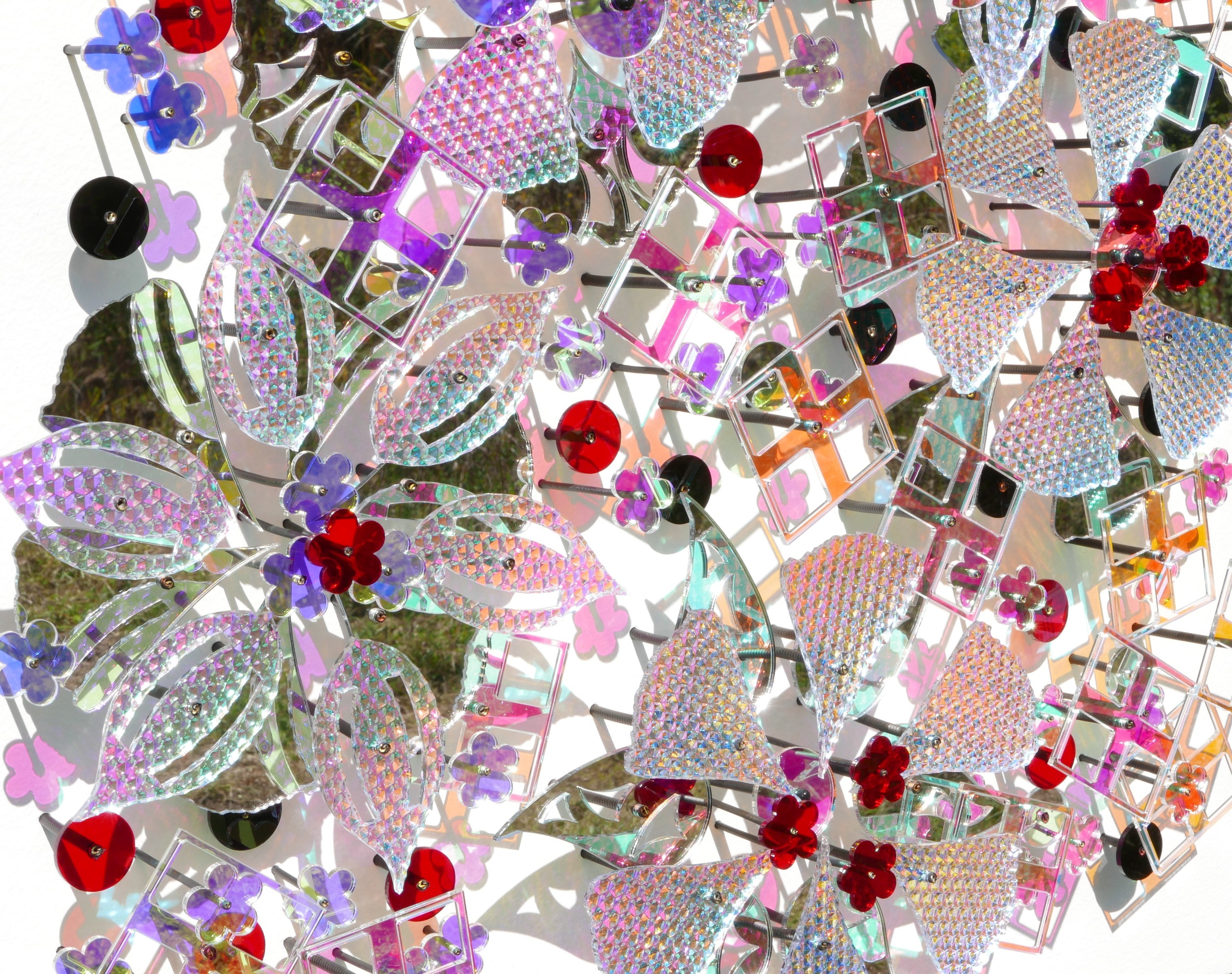 A picture of a bunch of different colored jewels on a white background.