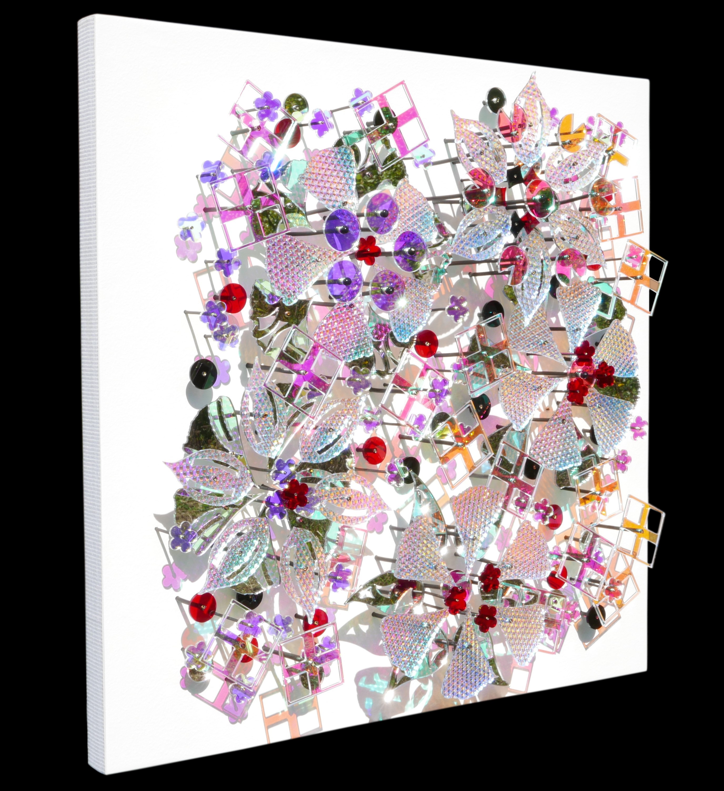 A picture of a bunch of different colored jewels on a white background.