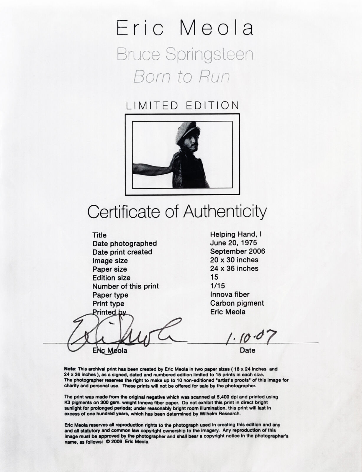 A black and white photo of a man wearing a hat.