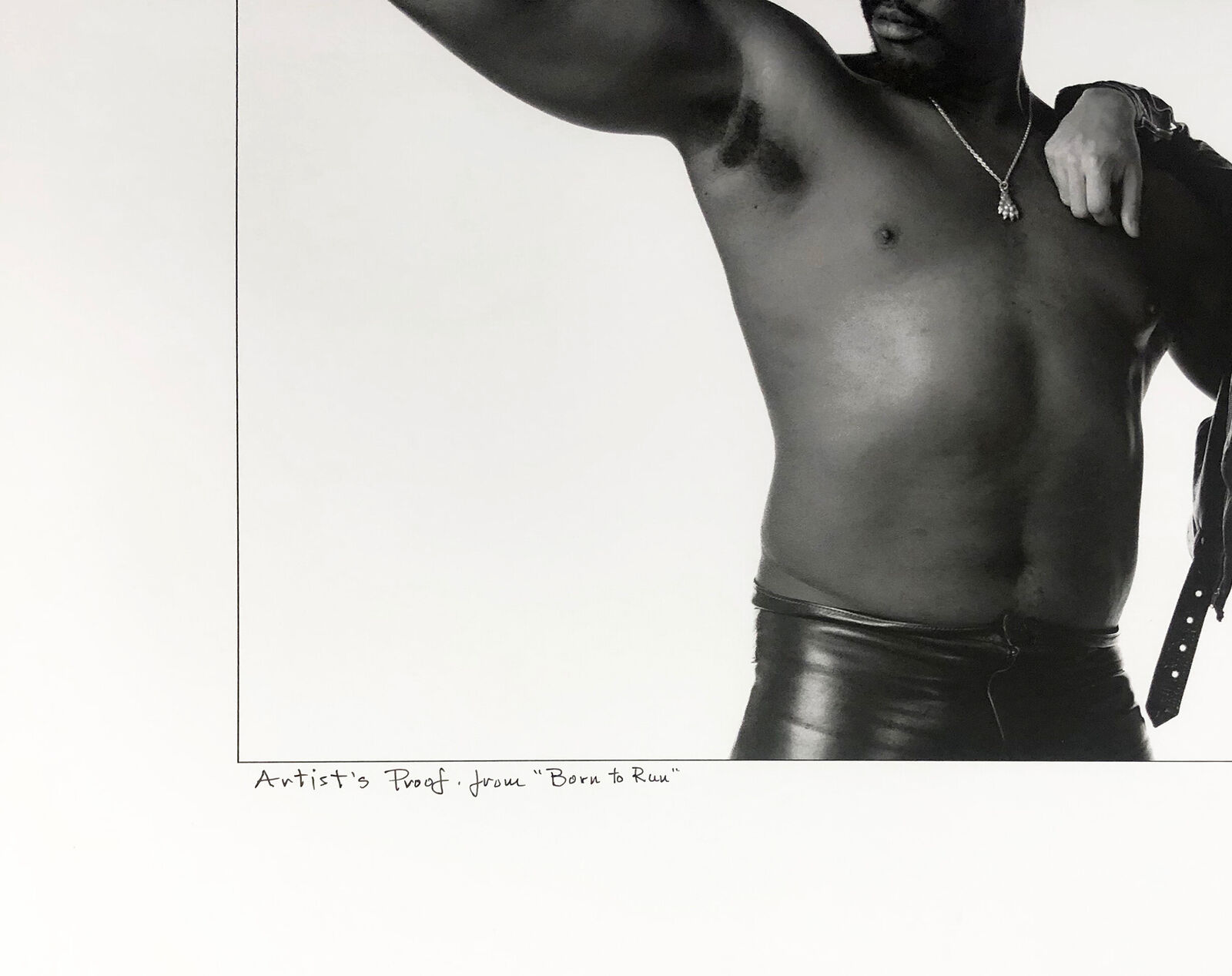 A black and white photo of two men posing for a picture.