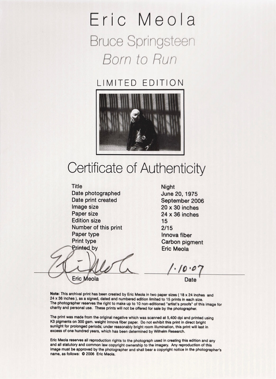 A black and white photo of a man wearing a mask.