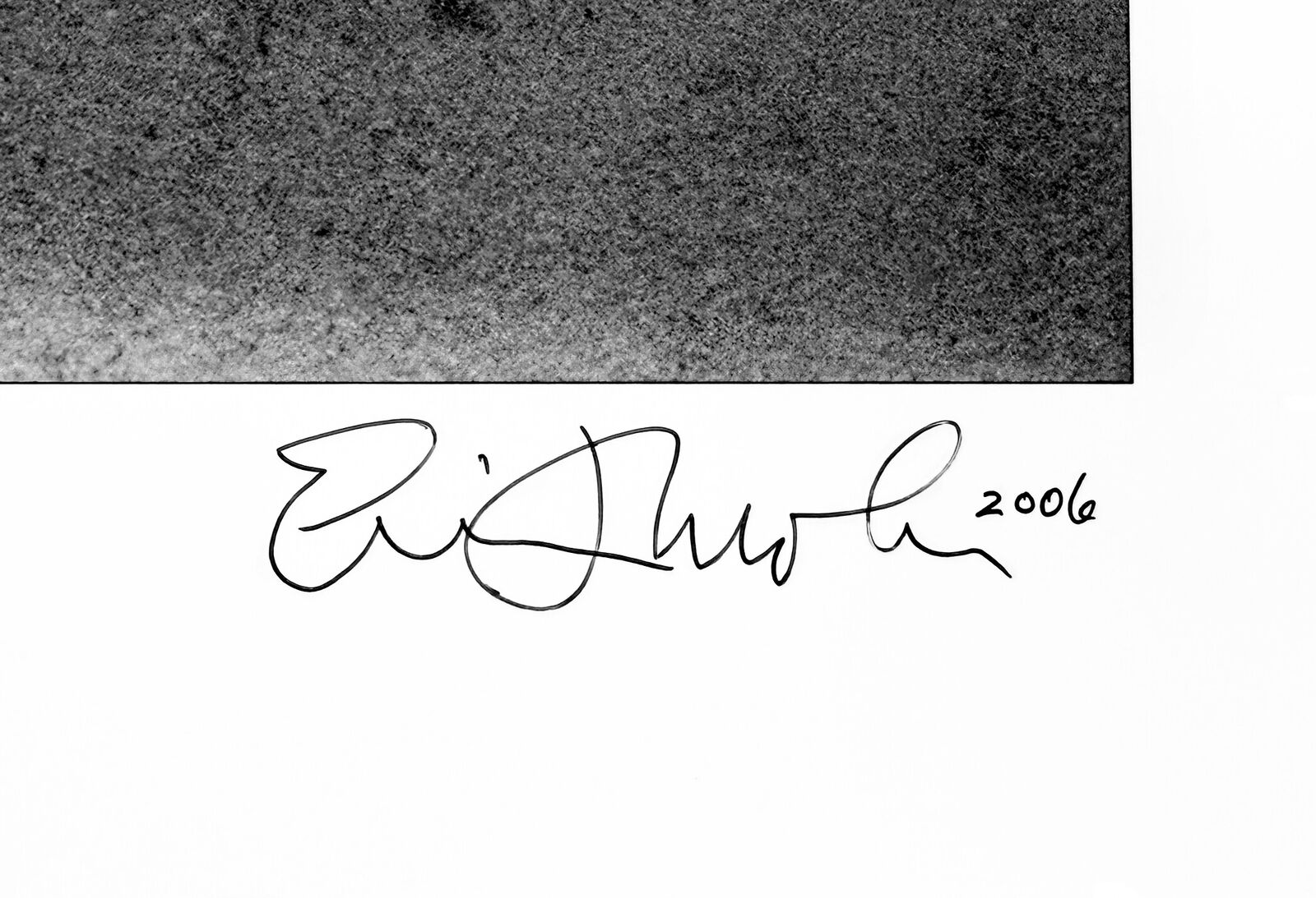 A black and white photo of a man wearing a mask.