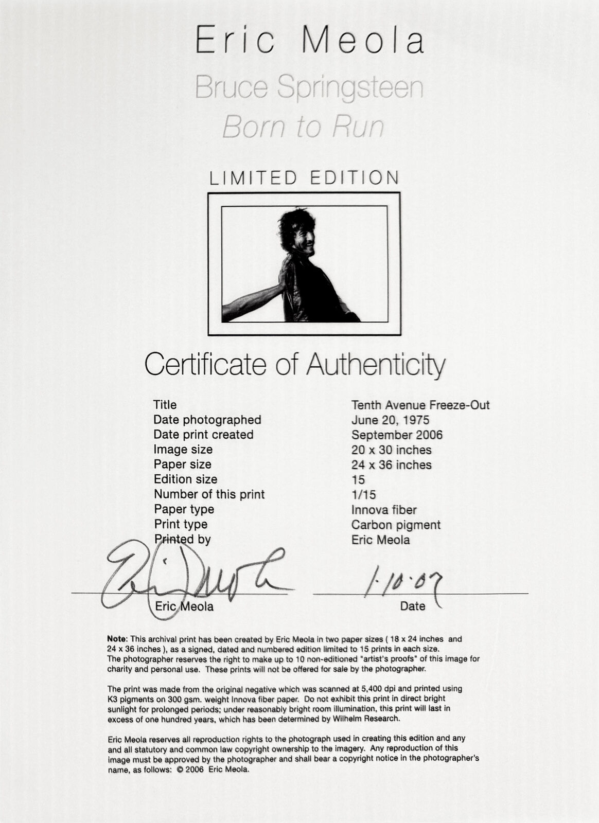 A black and white photo of a man in a leather jacket.