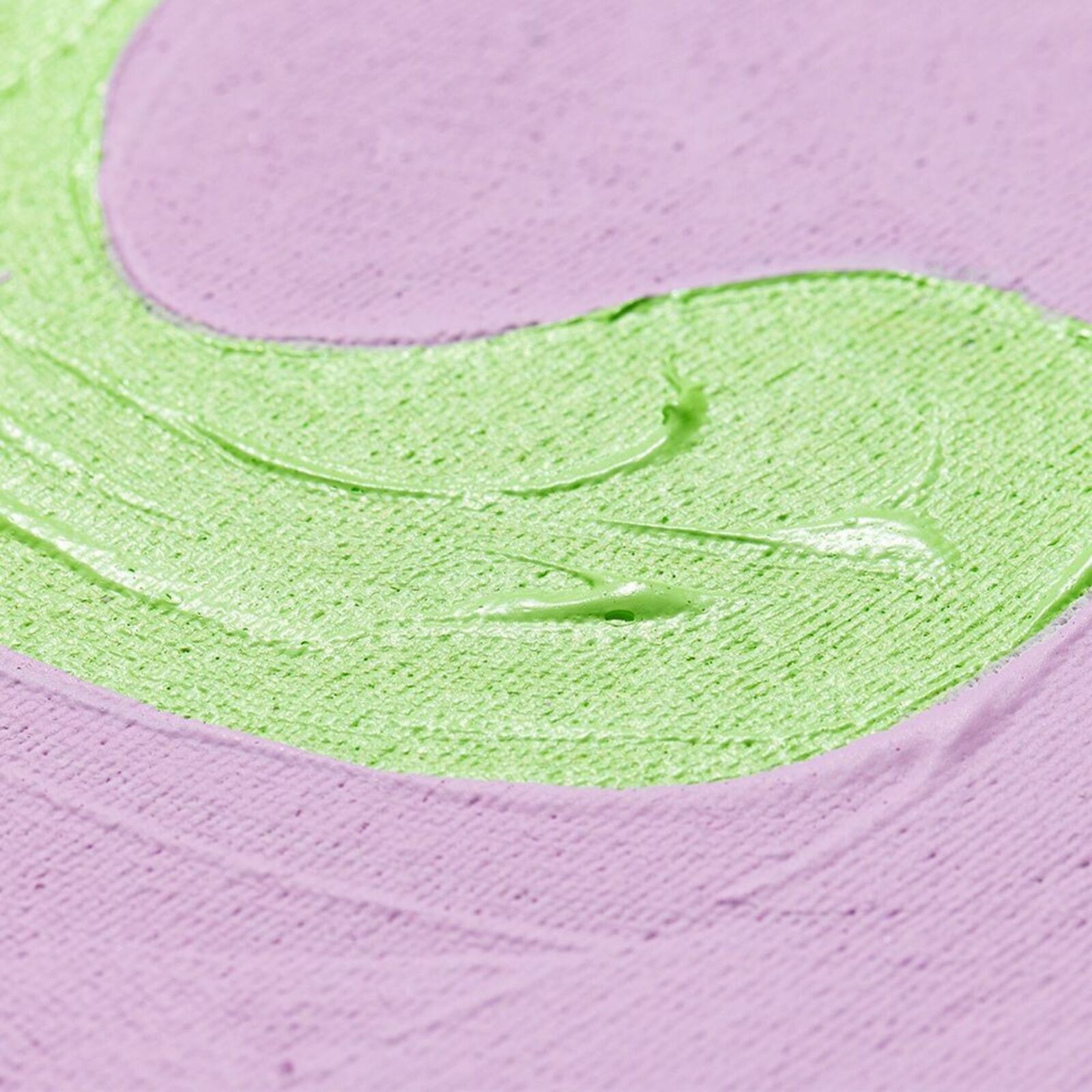 A painting on a wall with a pink and green background.