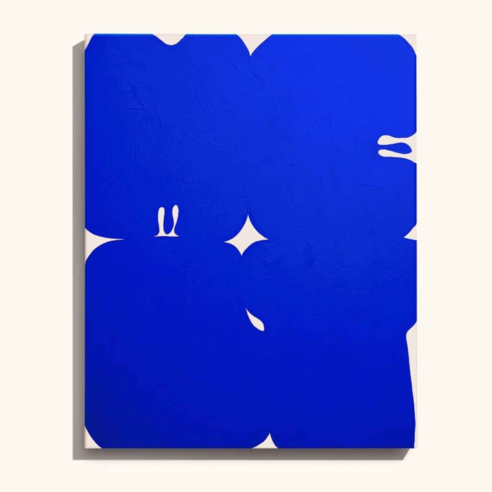 A blue and white painting on a white wall.