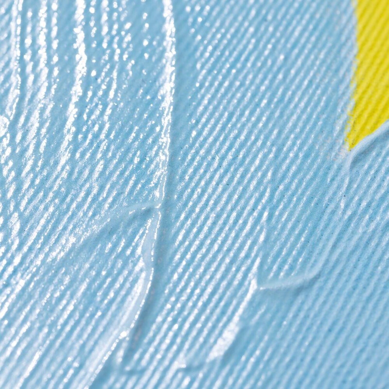 A blue and yellow painting on a white wall.