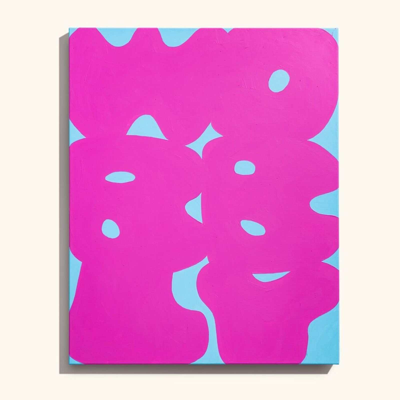 A set of four paintings on a white wall.