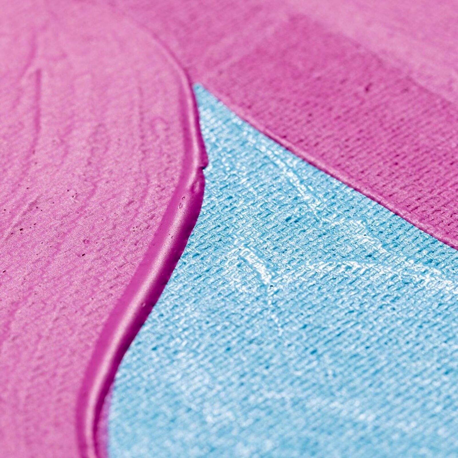 A pink and blue painting on a white wall.