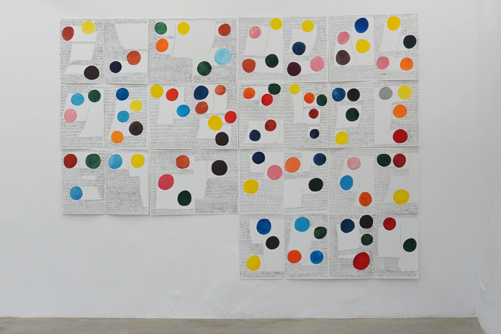 A large piece of art hanging on a wall in a room.