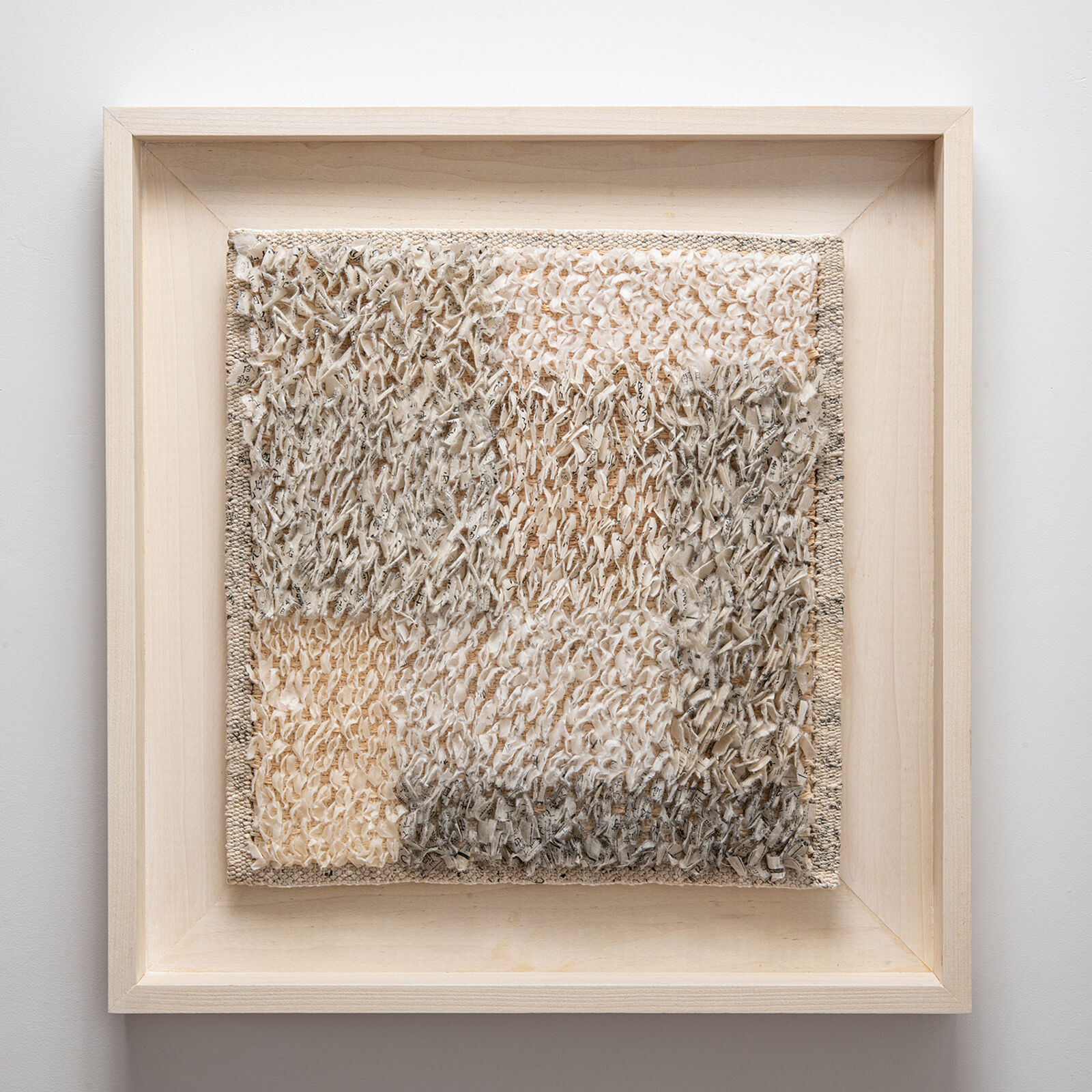 A picture of a piece of art hanging on a wall.